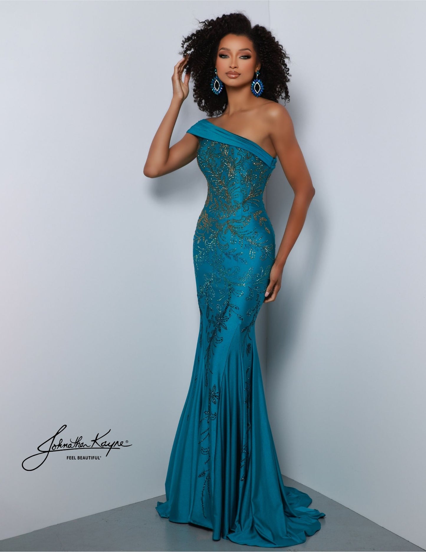 This Johnathan Kayne 2872 Long Prom Dress is designed to be impactful and stylish. The one shoulder beaded bodice. The mermaid train skirt flows to a dramatic finish. A perfect statement dress for the most special of occasions. You're ombre-viously dressed to impress in this one-shoulder gown! Crafted from 4 Way Stretch Lycra, this fit and flare gown is a vision of elegance. Don't forget to showcase off the back featuring the elegant cut outs.