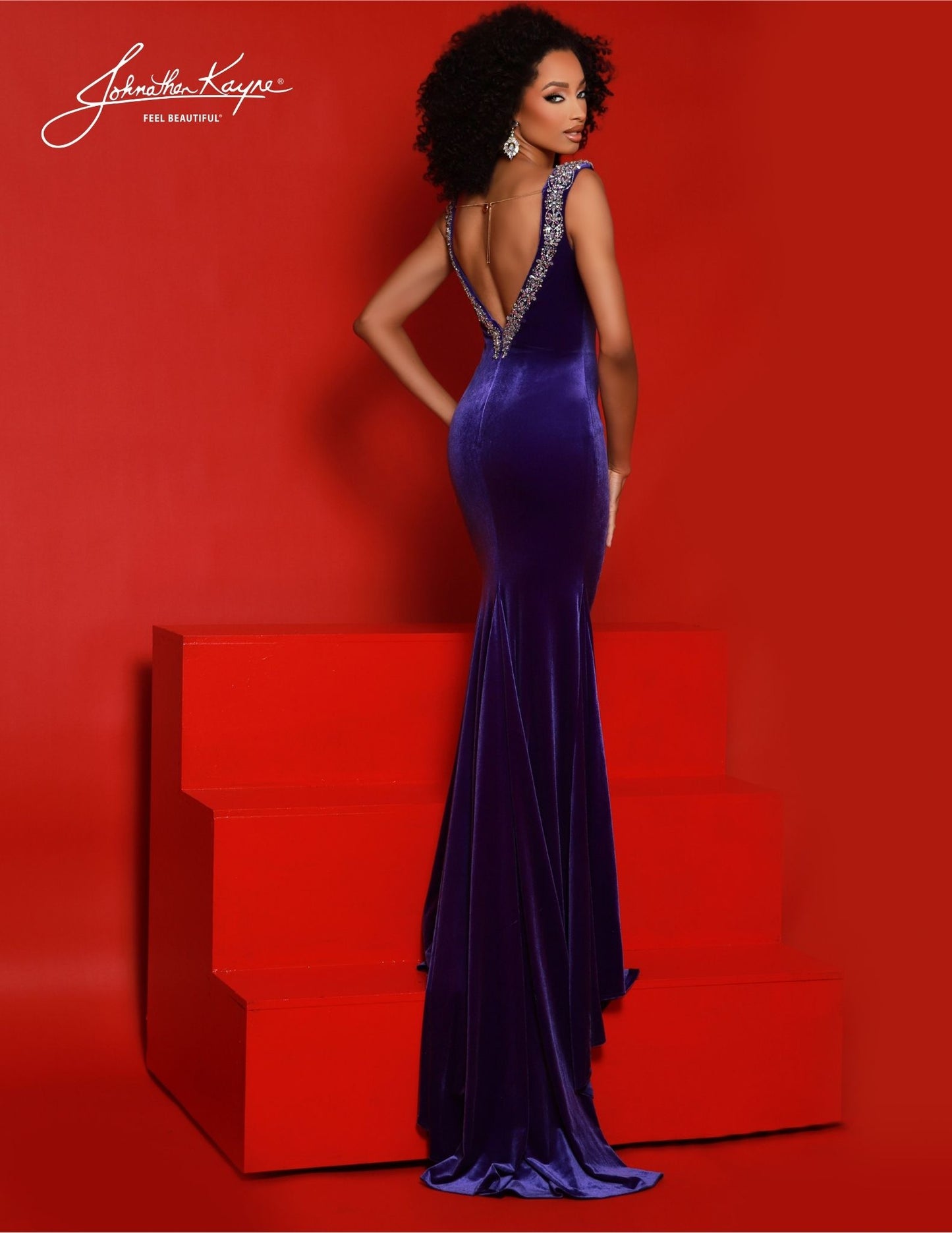 Featuring a low V-neckline, crystal straps, and a train, Johnathan Kayne 2877 is the perfect formal dress for special occasions. A beautiful velvet gown that flatters the figure with a beautiful silhouette, this Johnathan Kayne creation is sure to make a statement. Elegance knows no bounds in this stretch velvet gown. Adorned with encrusted crystal straps and a sultry low-V neckline, this gown exudes opulence and elegance. 