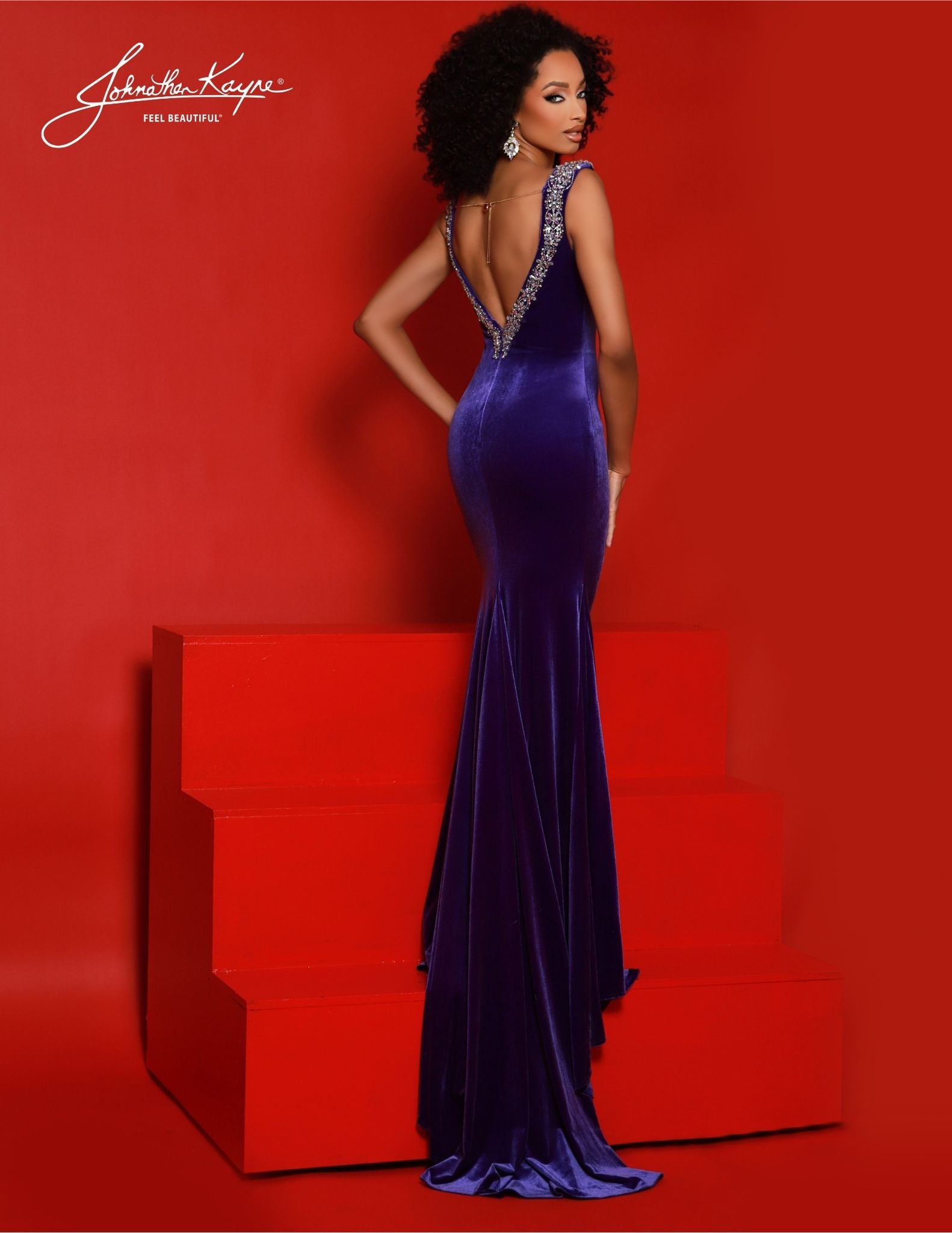 Featuring a low V-neckline, crystal straps, and a train, Johnathan Kayne 2877 is the perfect formal dress for special occasions. A beautiful velvet gown that flatters the figure with a beautiful silhouette, this Johnathan Kayne creation is sure to make a statement. Elegance knows no bounds in this stretch velvet gown. Adorned with encrusted crystal straps and a sultry low-V neckline, this gown exudes opulence and elegance. 