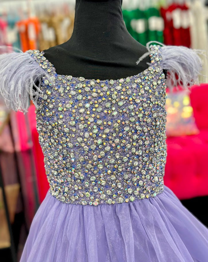 The Ava Presley 28821 Girls Pageant Dress is a stunning and luxurious option for any pageant or formal event. Featuring a feather ruffle ballgown, crystal bodice, and layered design, this dress exudes elegance and grace. With its intricate details and high-quality craftsmanship, your little one is sure to make a statement and feel like a true princess.

Sizes: 8

Colors: Lavender