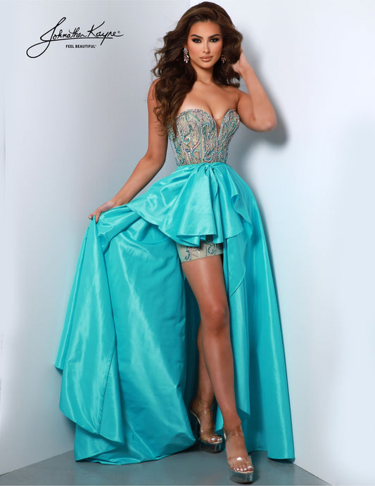 Expertly designed by Johnathan Kayne, the 2904 Sheer Beaded Corset High Low Pageant Dress features intricate beaded detailing, a flattering corset bodice, and a stunning bow overskirt. Perfect for making a statement at any pageant or special event, this dress combines elegance and fashion-forward style with its high-low hemline. Leave them in awe with our fun fashion strapless mesh gown. Featuring