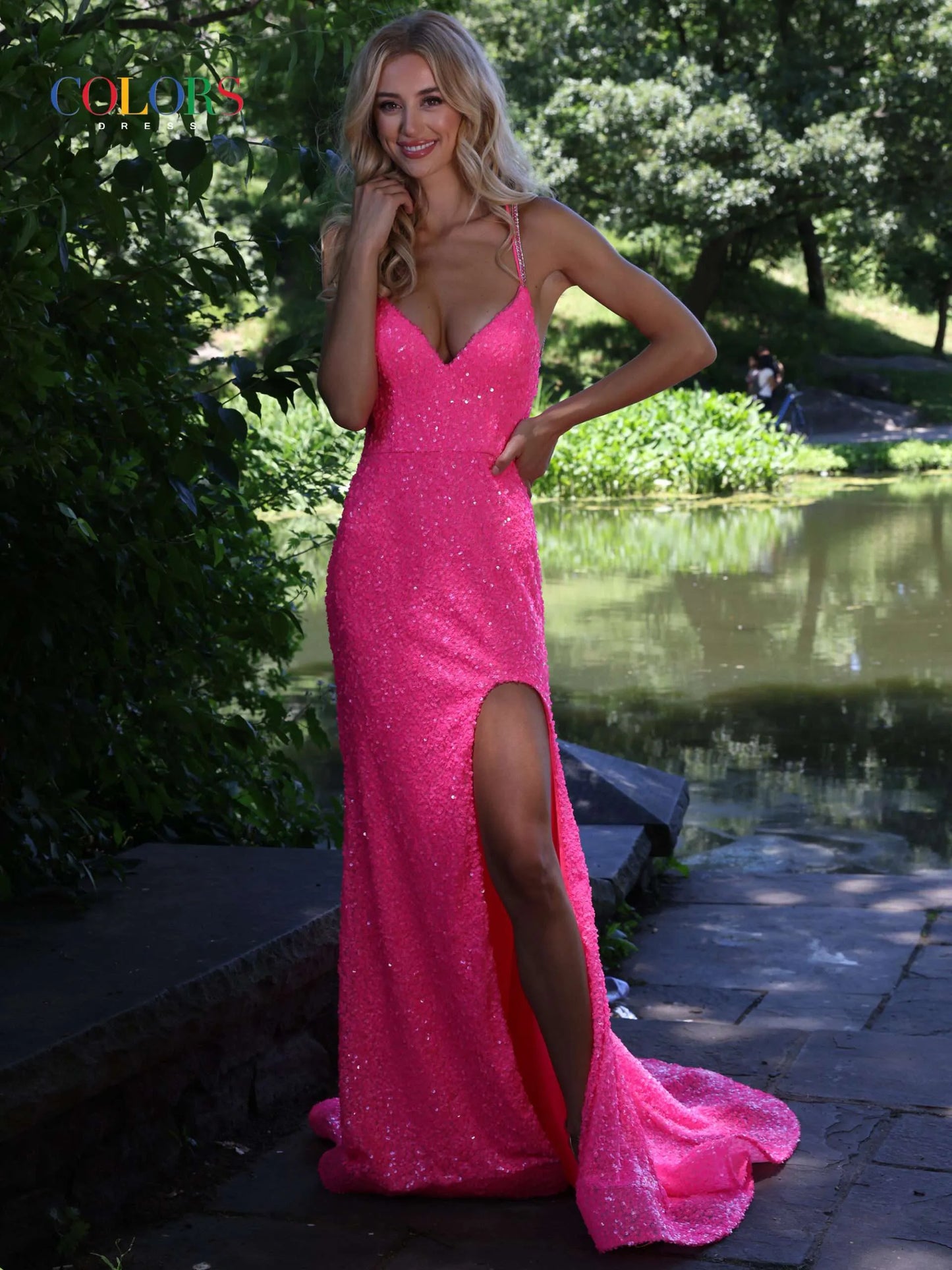 This Colors Dress 2975 long prom dress showcases a fitted design, accented with sparkling sequins and thin spaghetti straps. The dress features a high slit, offering a glamorous touch to your formal pageant look. Stand out from the crowd with this elegant and eye-catching gown.