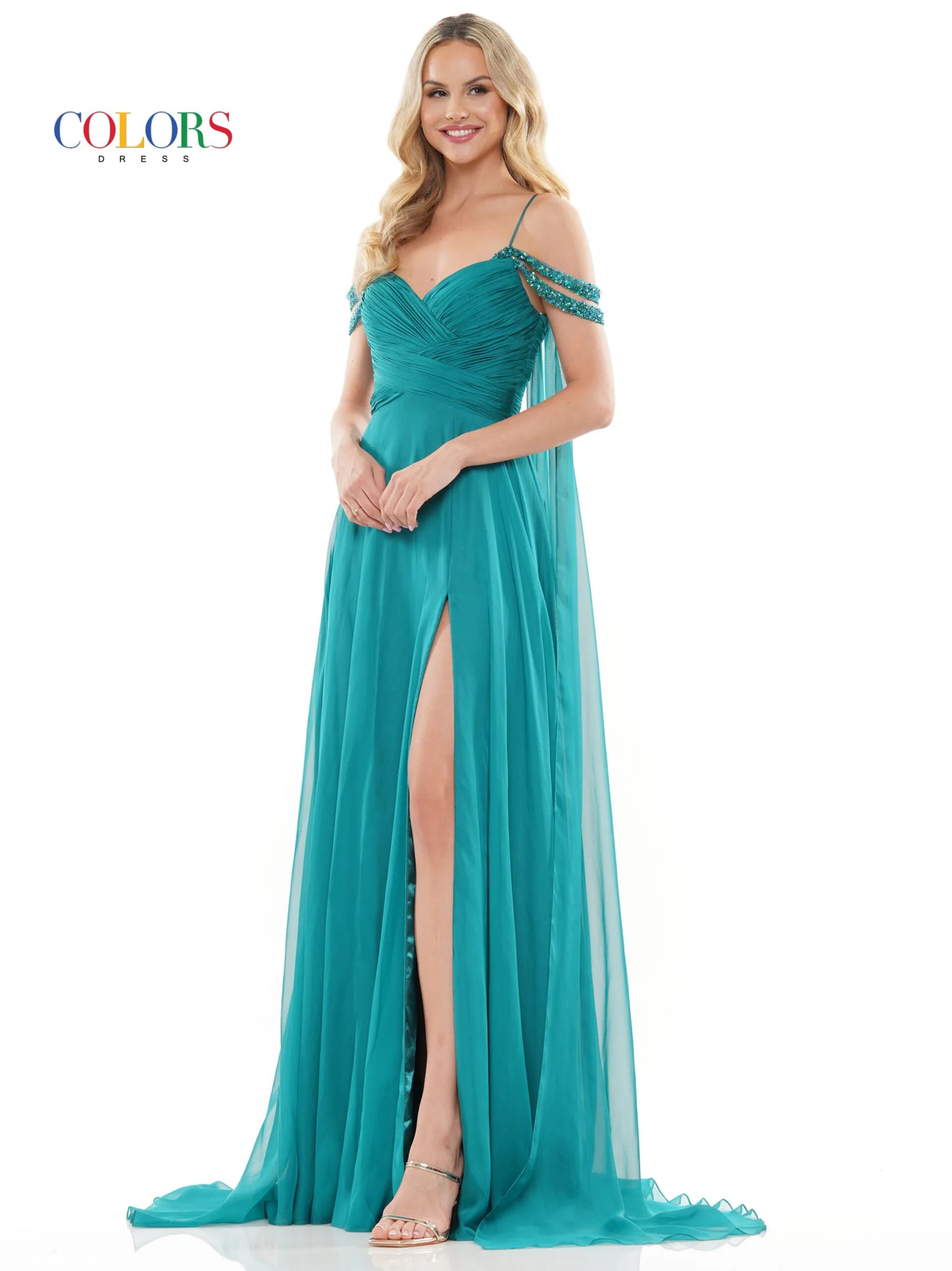 Elevate your style with the Colors Dress 3101 A Line Chiffon Pageant Dress. This stunning gown features an off the shoulder design and double beaded straps for a touch of elegance. The flowing chiffon cape adds a dramatic flair, while the maxi slit showcases your legs. Perfect for prom or any special occasion. corset back   Sizes: 0-20  Colors: Black, Royal, Deep Green, Hot Pink, Wine