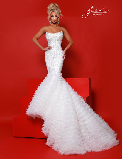 Elevate your special occasion with the Johnathan Kayne 3165 Mermaid Dress, featuring intricate beaded sequins that shimmer elegantly. This fitted gown highlights a sophisticated scoop neckline and a dramatic tulle ruffle handkerchief skirt with a graceful train, perfect for prom, pageants, or bridal events. Designed to flatter your silhouette, it combines timeless glamour with modern detail for a truly unforgettable look.

Sizes: 00-16

Colors: Red, White