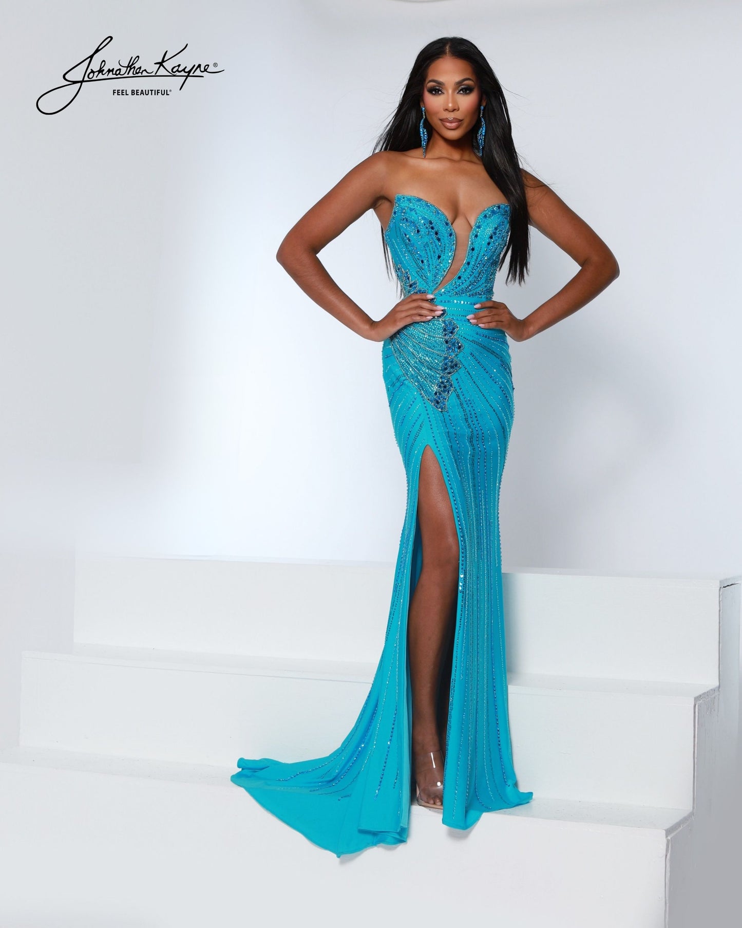 Designer: Johnathan Kayne — Style 3200
Designed in stretch knit fabrics, Johnathan Kayne style 3200 is a body-conscious long prom dress that offers both comfort and style. The stretchy construction allows the dress to move with you, making it a great option for pageant, prom, or any event where a fitted gown with flexibility is desired.

Sizes: 000, 00, 0, 2, 4, 6, 8, 10, 12, 14, 16
Colors: Aqua, Black, Flamingo