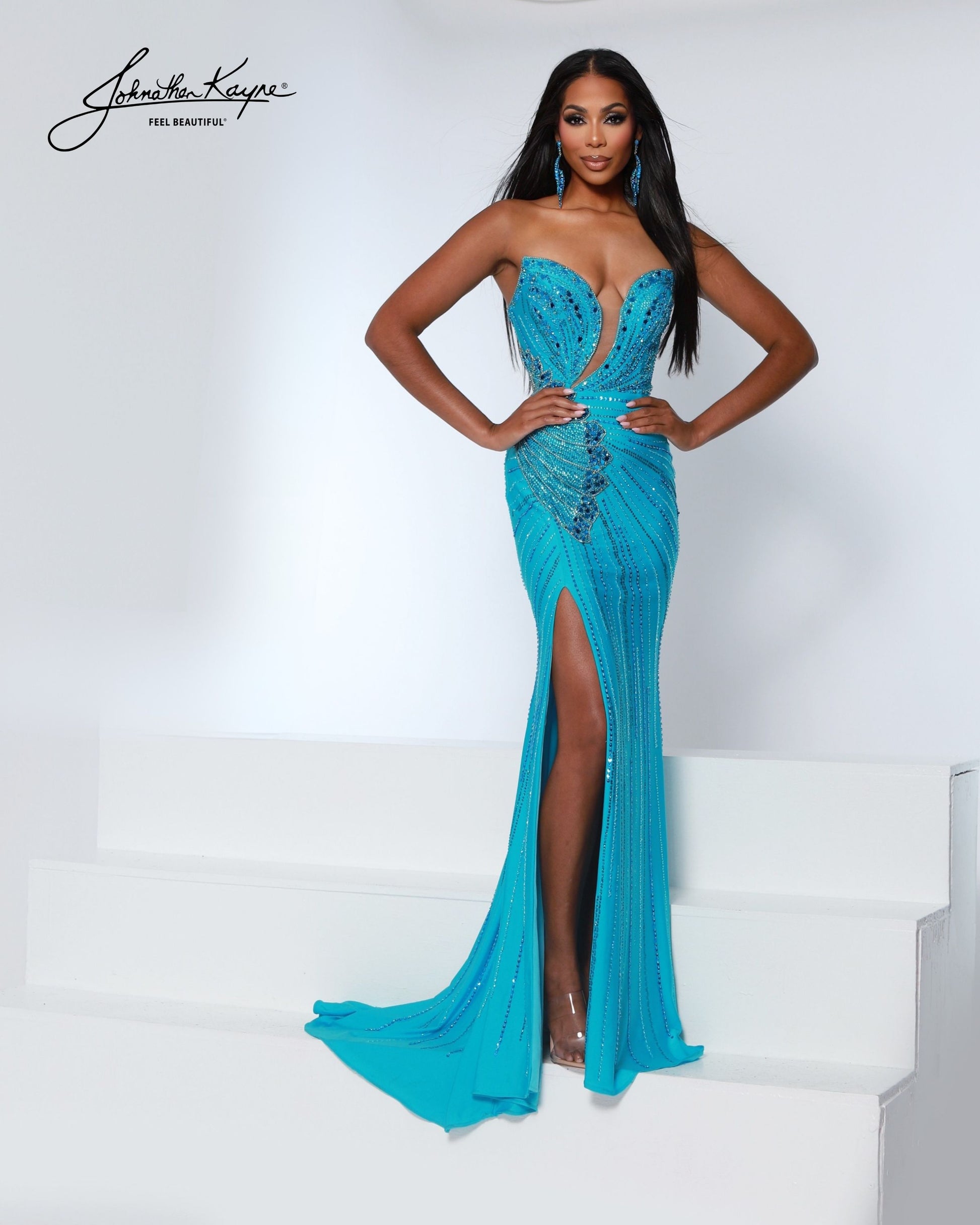 Designer: Johnathan Kayne — Style 3200
Designed in stretch knit fabrics, Johnathan Kayne style 3200 is a body-conscious long prom dress that offers both comfort and style. The stretchy construction allows the dress to move with you, making it a great option for pageant, prom, or any event where a fitted gown with flexibility is desired.

Sizes: 000, 00, 0, 2, 4, 6, 8, 10, 12, 14, 16
Colors: Aqua, Black, Flamingo