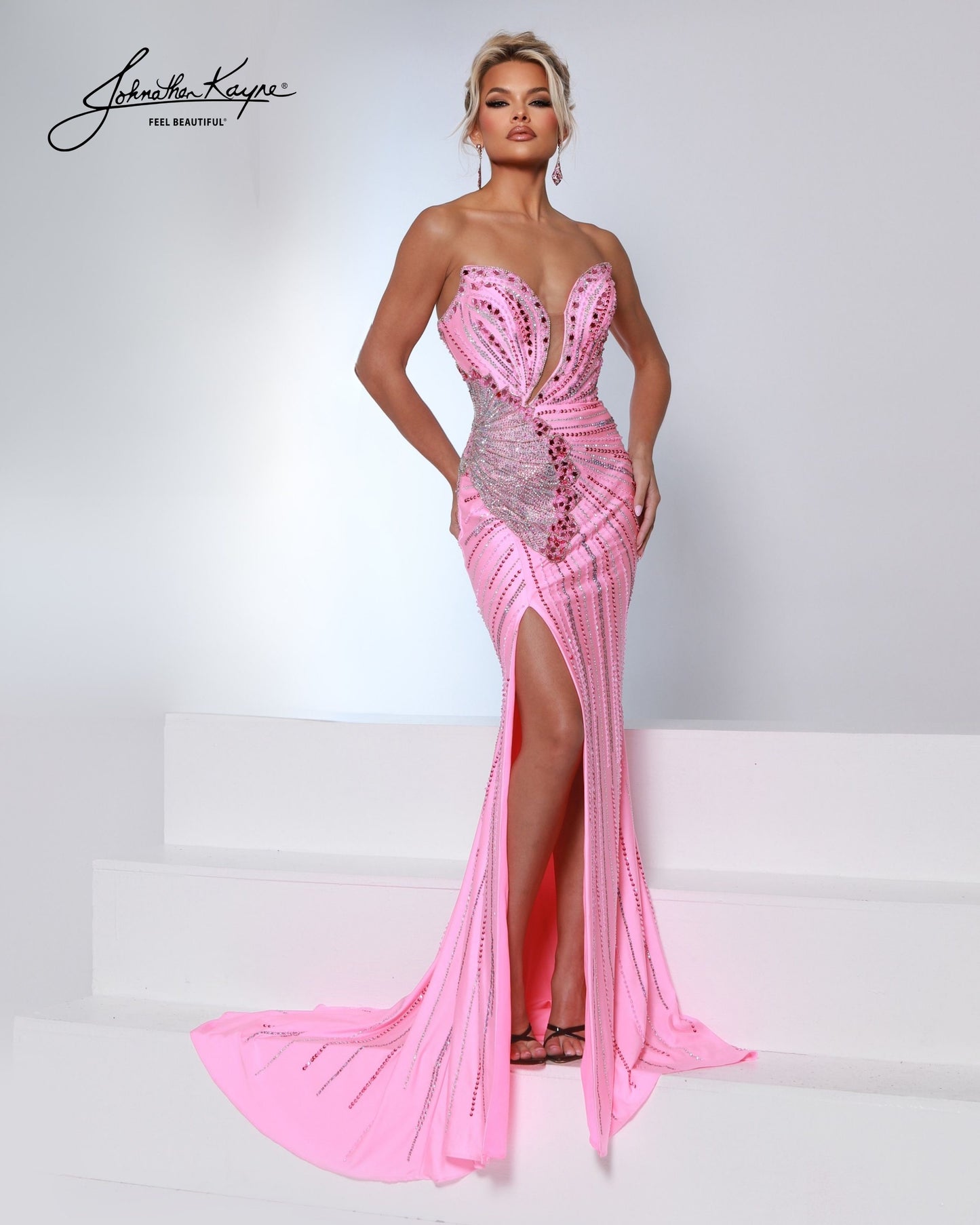 Designer: Johnathan Kayne — Style 3200
Designed in stretch knit fabrics, Johnathan Kayne style 3200 is a body-conscious long prom dress that offers both comfort and style. The stretchy construction allows the dress to move with you, making it a great option for pageant, prom, or any event where a fitted gown with flexibility is desired.

Sizes: 000, 00, 0, 2, 4, 6, 8, 10, 12, 14, 16
Colors: Aqua, Black, Flamingo