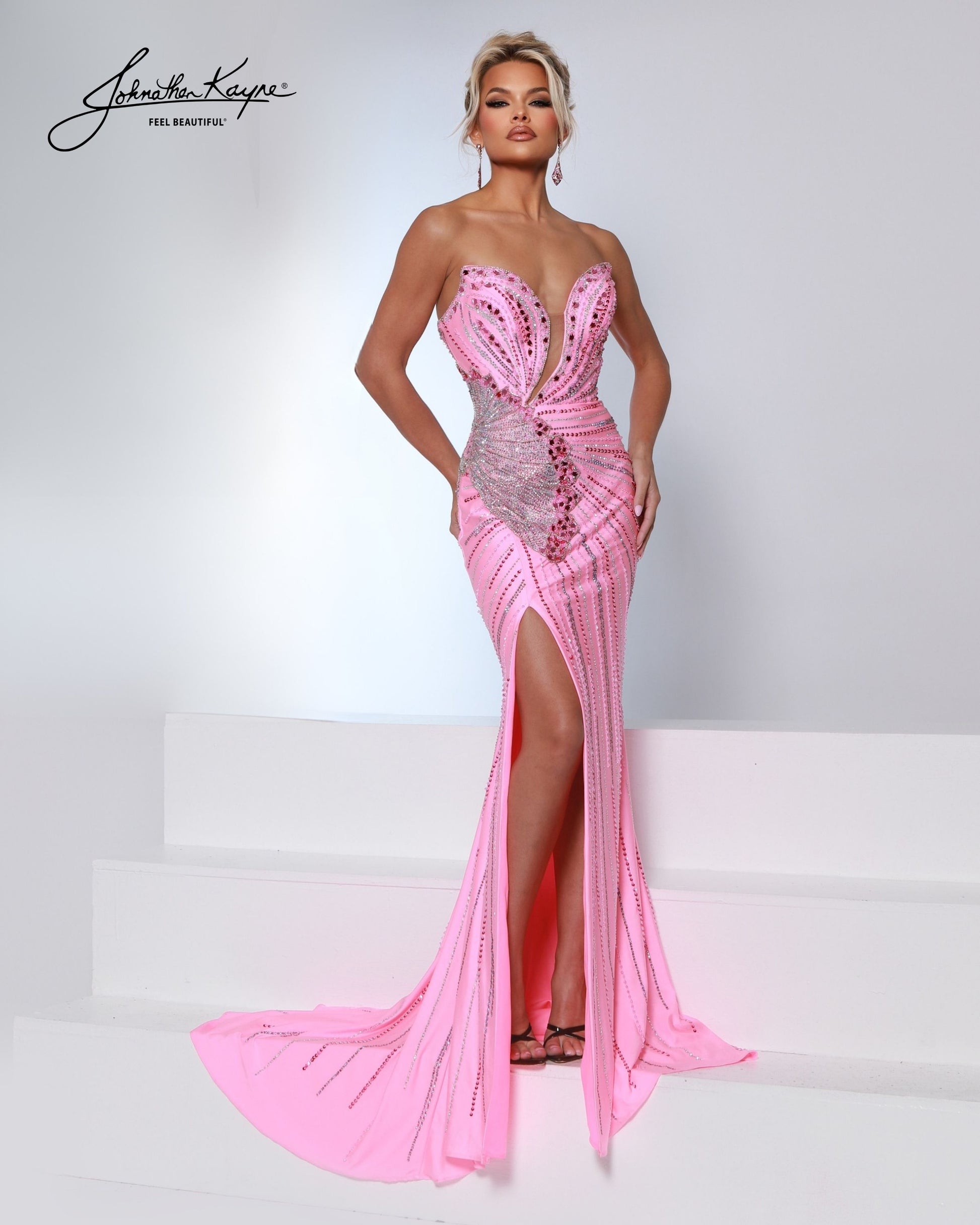 Designer: Johnathan Kayne — Style 3200
Designed in stretch knit fabrics, Johnathan Kayne style 3200 is a body-conscious long prom dress that offers both comfort and style. The stretchy construction allows the dress to move with you, making it a great option for pageant, prom, or any event where a fitted gown with flexibility is desired.

Sizes: 000, 00, 0, 2, 4, 6, 8, 10, 12, 14, 16
Colors: Aqua, Black, Flamingo