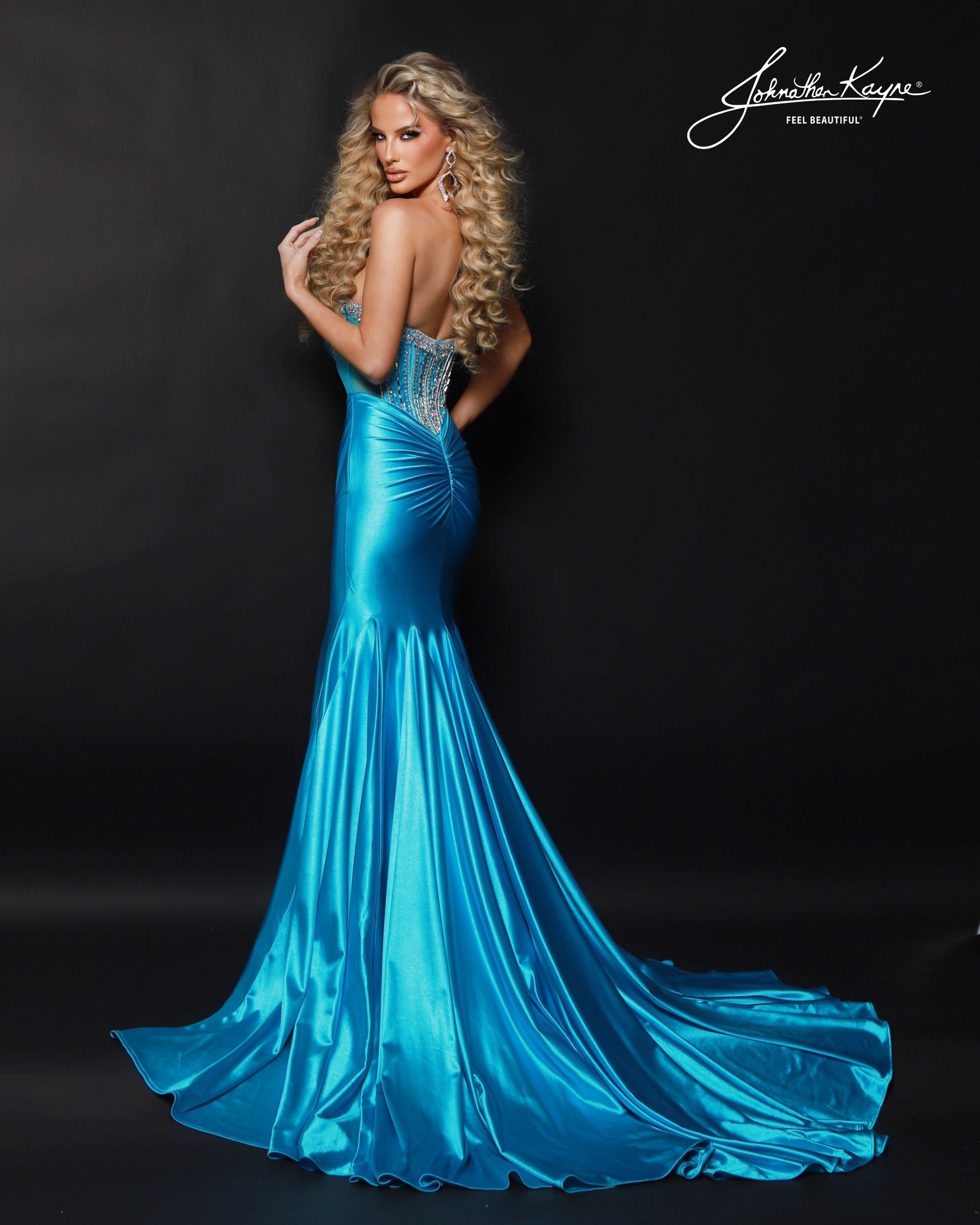 Designer: Johnathan Kayne — Style 3203
Designed in stretch knit fabrics, Johnathan Kayne style 3203 is a body-conscious long prom dress that offers both comfort and style. The stretchy construction allows the dress to move with you, making it a great option for pageant, prom, or any event where a fitted gown with flexibility is desired.

Sizes: 000, 00, 0, 2, 4, 6, 8, 10, 12, 14, 16
Colors: Aqua, Hot Coral, White