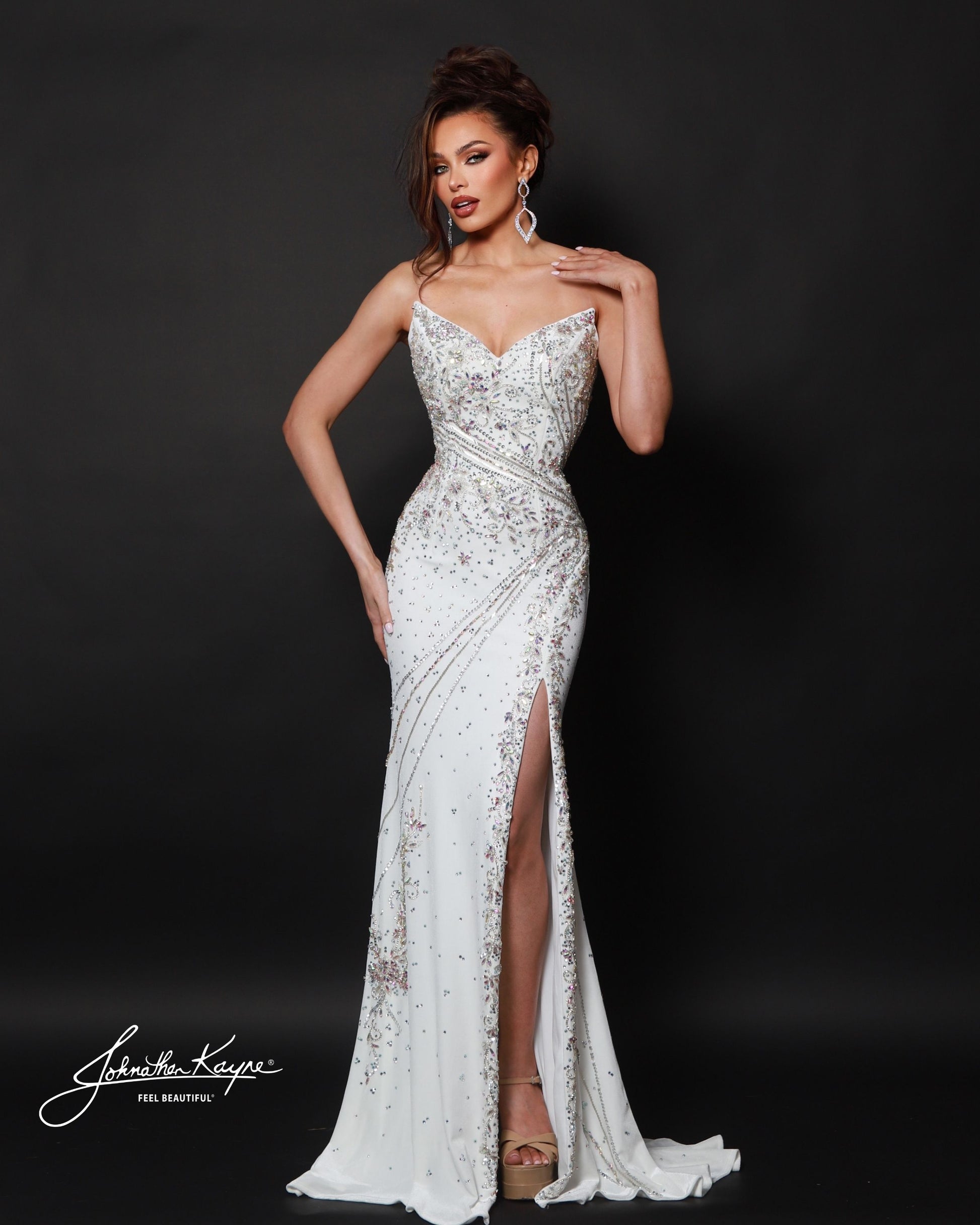 Designer: Johnathan Kayne — Style 3208
Johnathan Kayne style 3208 is a luxurious stretch velvet long prom dress designed to hug the figure while still allowing comfortable movement. The rich fabric paired with sleek design lines makes this gown ideal for pageant stages, long prom nights, and formal events where a dramatic, upscale dress is a must.

Sizes: 000, 00, 0, 2, 4, 6, 8, 10, 12, 14, 16
Colors: Emerald, Royal, White