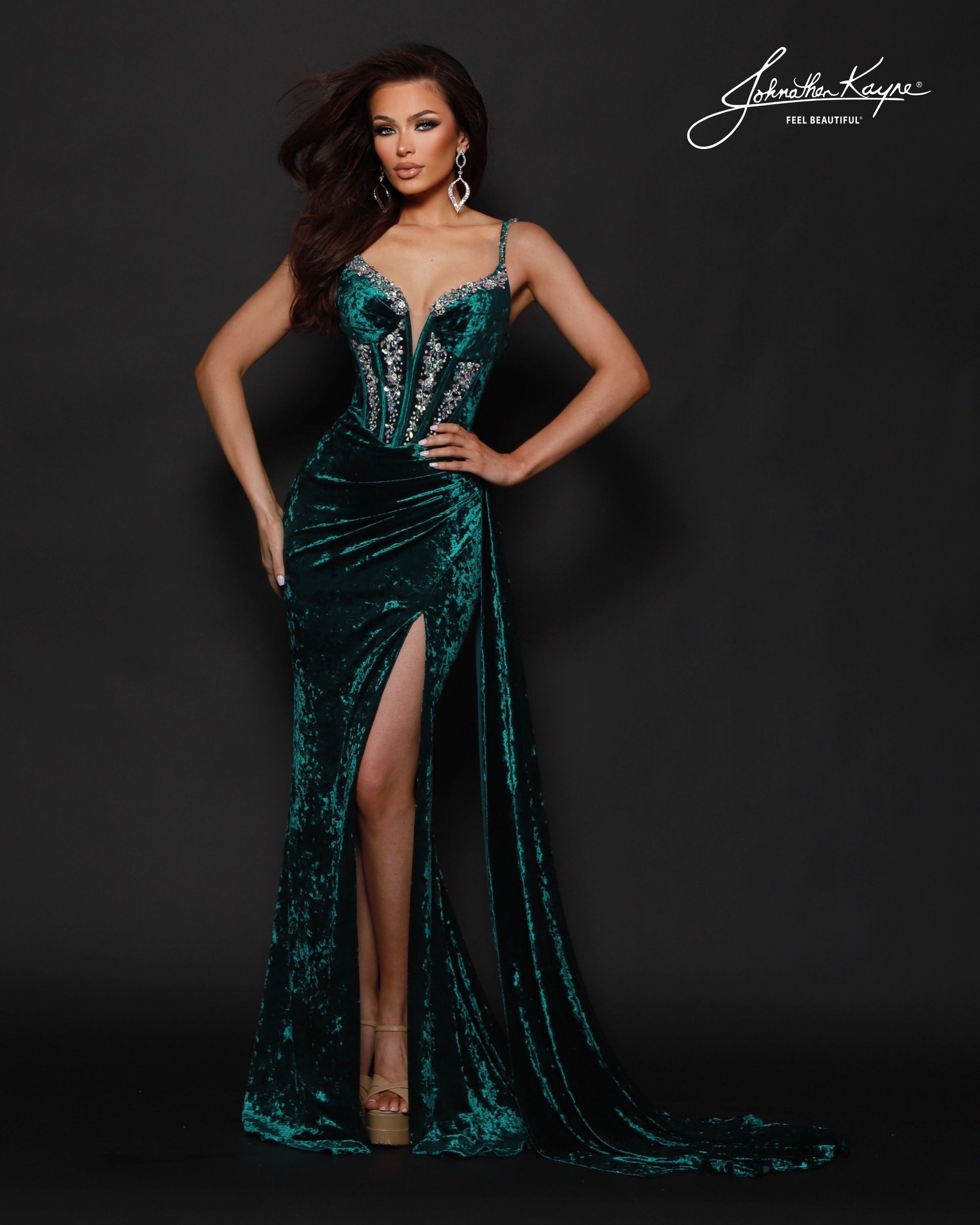 Designer: Johnathan Kayne — Style 3213
Johnathan Kayne style 3213 is a luxurious stretch velvet long prom dress designed to hug the figure while still allowing comfortable movement. The rich fabric paired with sleek design lines makes this gown ideal for pageant stages, long prom nights, and formal events where a dramatic, upscale dress is a must.

Sizes: 000, 00, 0, 2, 4, 6, 8, 10, 12, 14, 16
Colors: Emerald, Navy