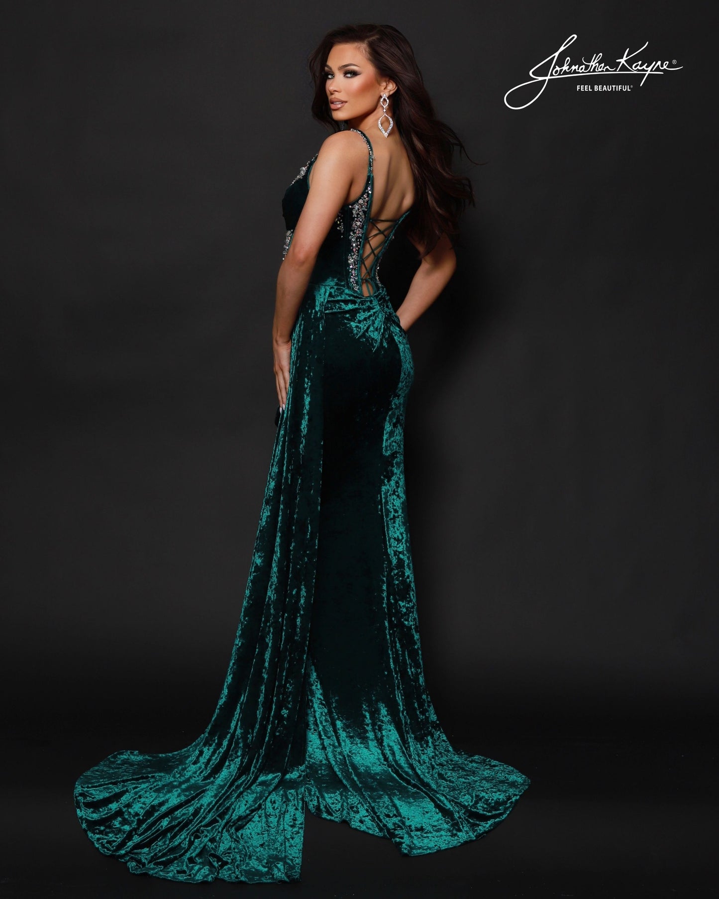 Designer: Johnathan Kayne — Style 3213
Johnathan Kayne style 3213 is a luxurious stretch velvet long prom dress designed to hug the figure while still allowing comfortable movement. The rich fabric paired with sleek design lines makes this gown ideal for pageant stages, long prom nights, and formal events where a dramatic, upscale dress is a must.

Sizes: 000, 00, 0, 2, 4, 6, 8, 10, 12, 14, 16
Colors: Emerald, Navy