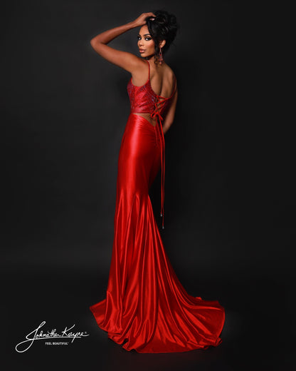 Designer: Johnathan Kayne — Style 3218
Designed in stretch knit fabrics, Johnathan Kayne style 3218 is a body-conscious long prom dress that offers both comfort and style. The stretchy construction allows the dress to move with you, making it a great option for pageant, prom, or any event where a fitted gown with flexibility is desired.

Sizes: 000, 00, 0, 2, 4, 6, 8, 10, 12, 14, 16
Colors: Black, Navy, Red
