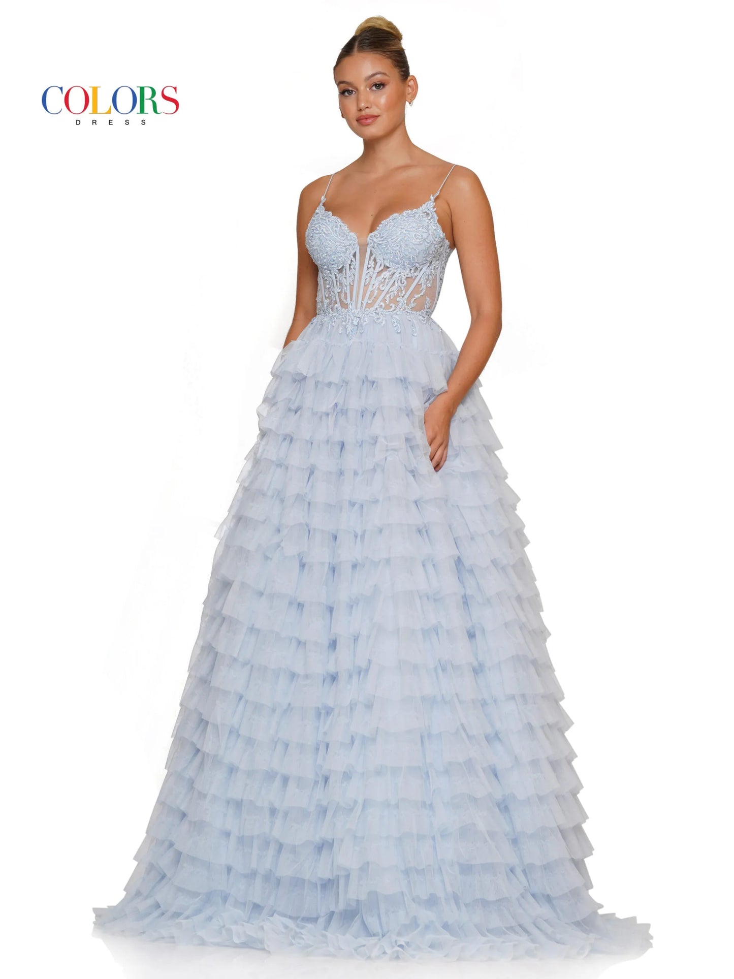 Colors Dress 3219 is a formal gown featuring a long sheer lace embellished v neck corset with ruffled layers and an elegant ball gown skirt. Embellished details add a luxurious touch to the design, making it perfect for proms and special occasions.  Sizes: 2-24  Colors: Black, Light Blue, Mint, Pink