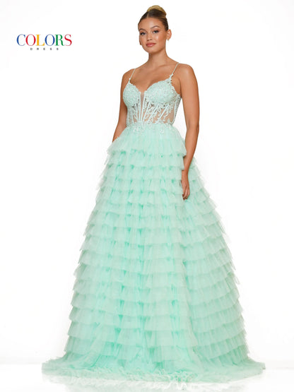 Colors Dress 3219 is a formal gown featuring a long sheer lace embellished v neck corset with ruffled layers and an elegant ball gown skirt. Embellished details add a luxurious touch to the design, making it perfect for proms and special occasions.  Sizes: 2-24  Colors: Black, Light Blue, Mint, Pink