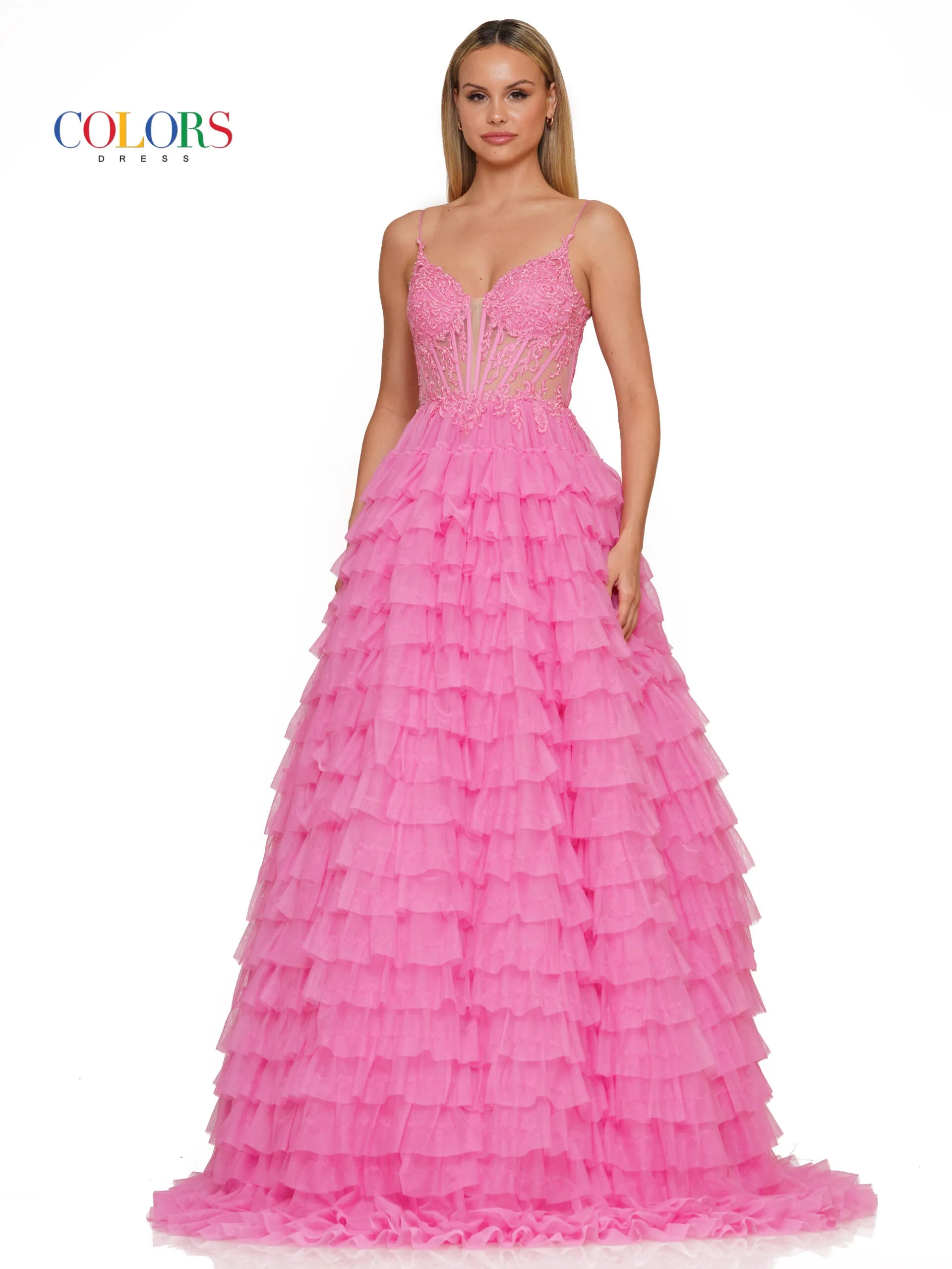 Colors Dress 3219 is a formal gown featuring a long sheer lace embellished v neck corset with ruffled layers and an elegant ball gown skirt. Embellished details add a luxurious touch to the design, making it perfect for proms and special occasions.  Sizes: 2-24  Colors: Black, Light Blue, Mint, Pink