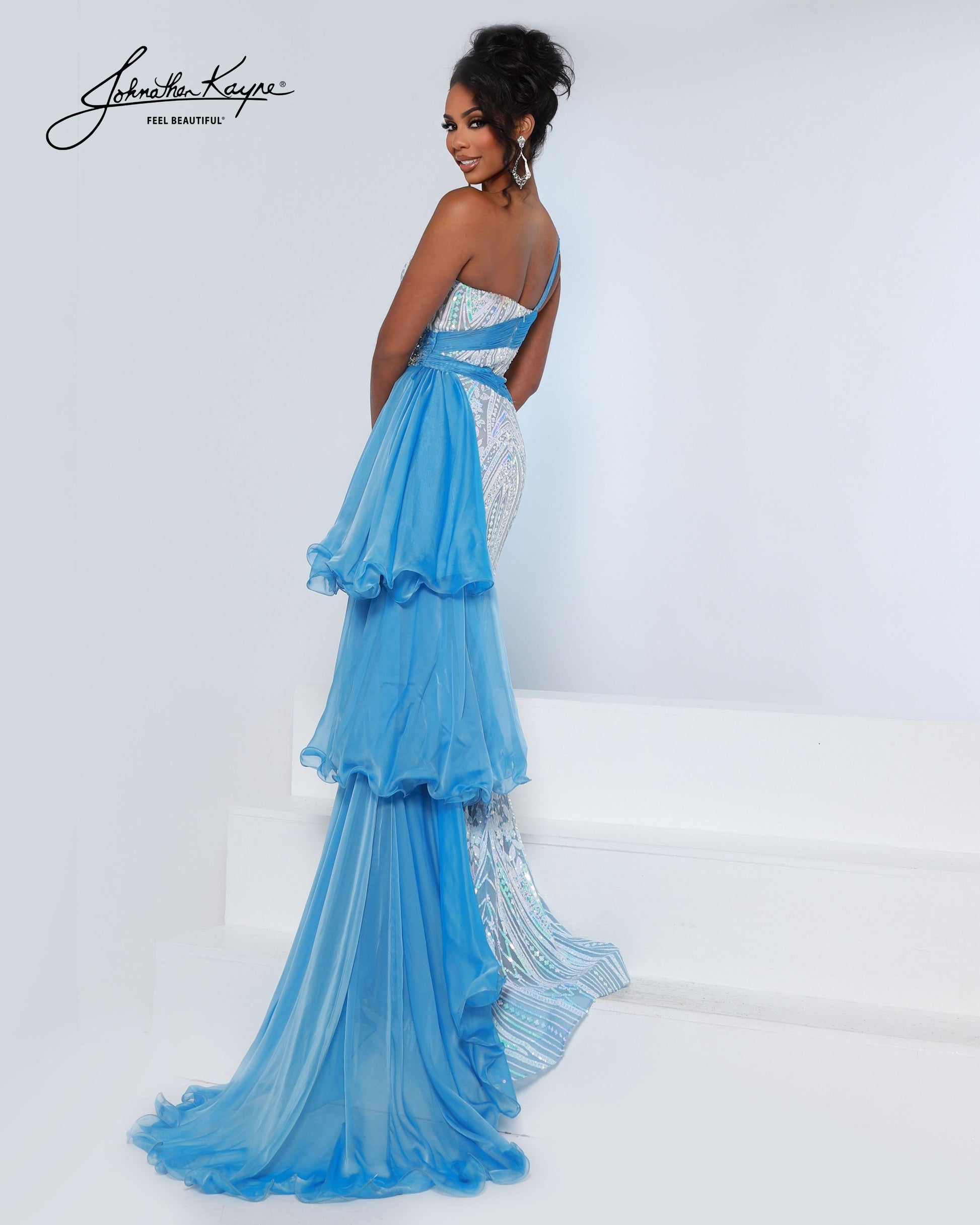 Designer: Johnathan Kayne — Style 3219
Style 3219 is a flowy Johnathan Kayne long prom dress crafted from lightweight special occasion fabrics for beautiful movement. The skirt glides effortlessly with every step, creating an elegant pageant dress silhouette that photographs beautifully and stands out on stage or on the dance floor.

Sizes: 000, 00, 0, 2, 4, 6, 8, 10, 12, 14, 16
Colors: Sky Blue, Lilac