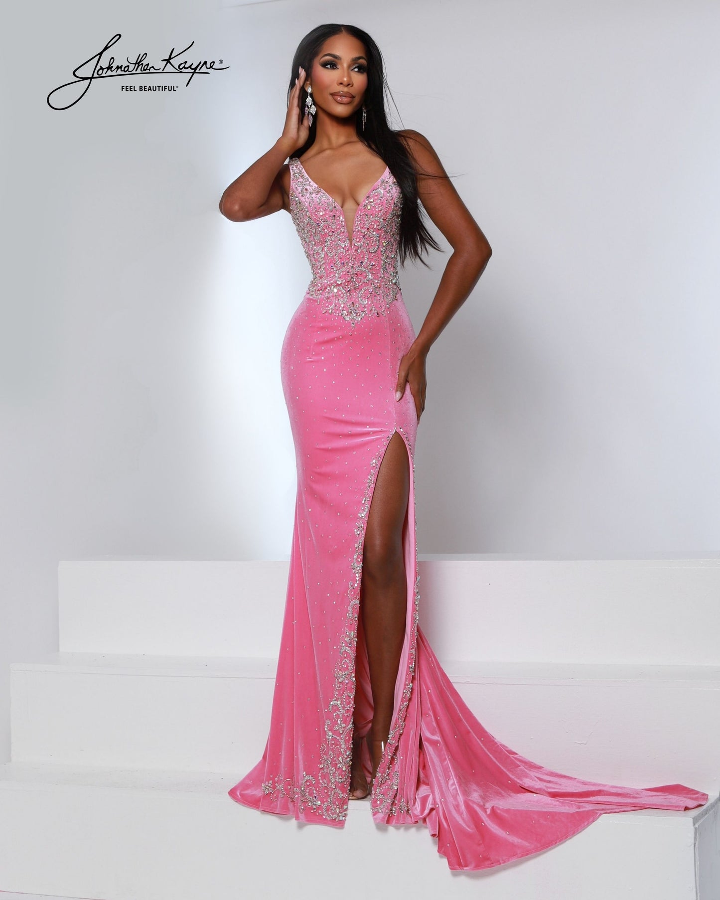 Designer: Johnathan Kayne — Style 3225
Johnathan Kayne style 3225 is a luxurious stretch velvet long prom dress designed to hug the figure while still allowing comfortable movement. The rich fabric paired with sleek design lines makes this gown ideal for pageant stages, long prom nights, and formal events where a dramatic, upscale dress is a must.

Sizes: 000, 00, 0, 2, 4, 6, 8, 10, 12, 14, 16
Colors: Black, Flamingo, Royal