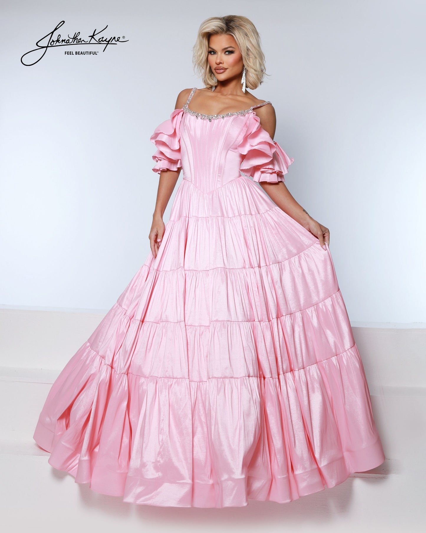 Designer: Johnathan Kayne — Style 3230
Johnathan Kayne style 3230 is a sleek long prom dress in a smooth, structured fabric that highlights the natural shape of the body. The clean lines and refined details make this gown a versatile choice for prom, pageant, and evening occasions that call for a polished, modern gown.

Sizes: 000, 00, 0, 2, 4, 6, 8, 10, 12, 14, 16
Colors: Aqua, Black, Petal Pink