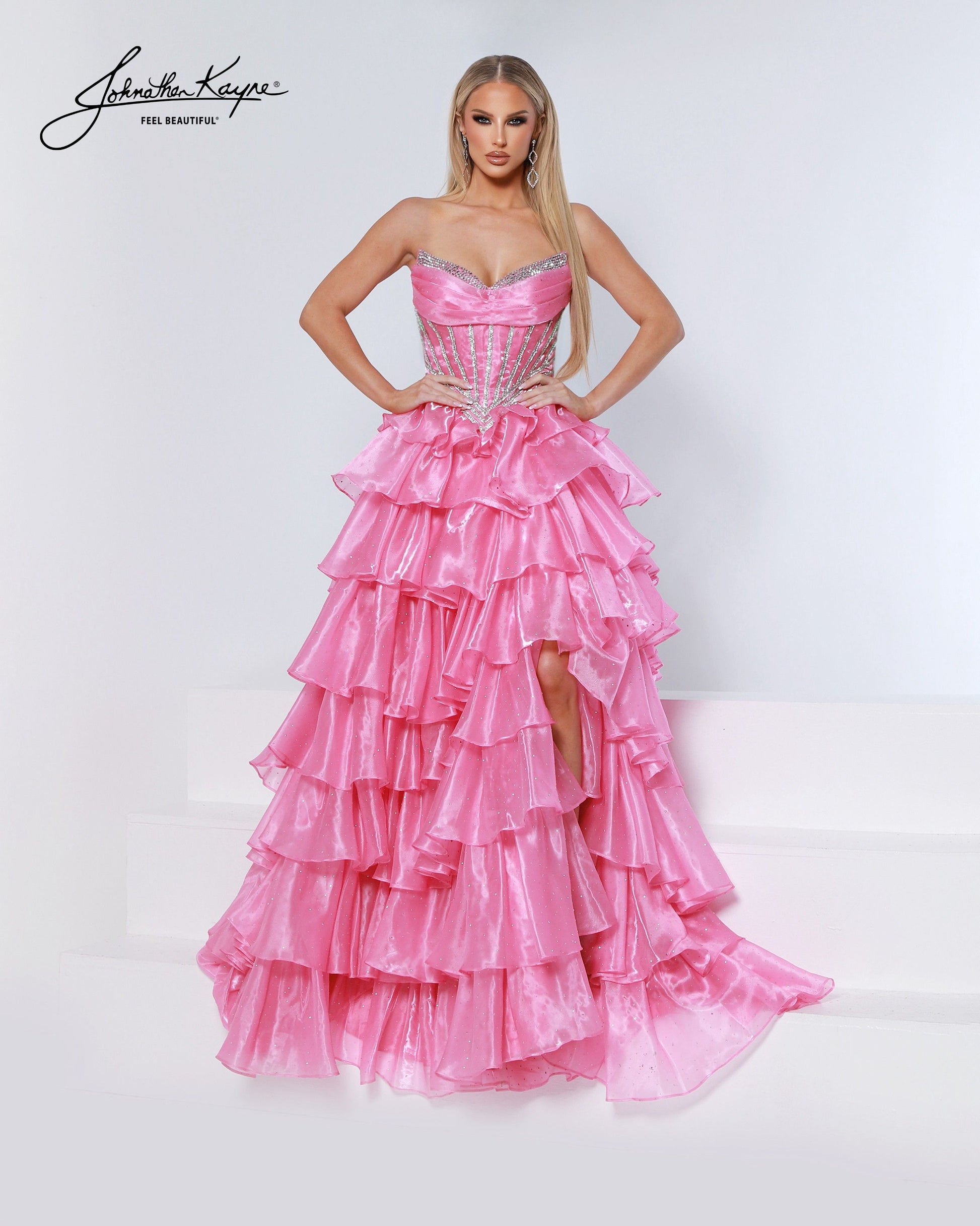 Designer: Johnathan Kayne — Style 3232
Style 3232 is a flowy Johnathan Kayne long prom dress crafted from lightweight special occasion fabrics for beautiful movement. The skirt glides effortlessly with every step, creating an elegant pageant dress silhouette that photographs beautifully and stands out on stage or on the dance floor.

Sizes: 000, 00, 0, 2, 4, 6, 8, 10, 12, 14, 16
Colors: Barbie Pink, Cherry, Emerald, Midnight
