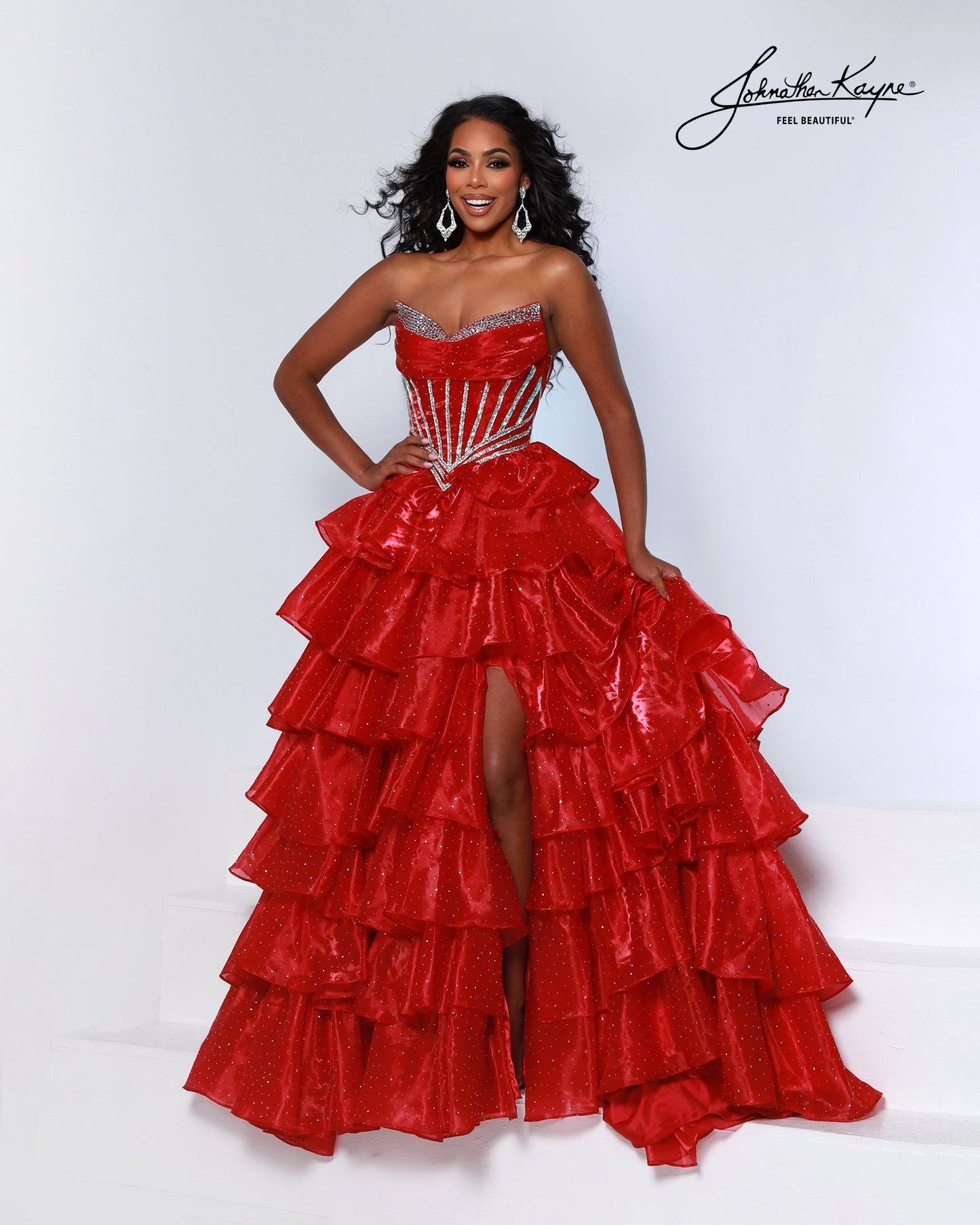 Designer: Johnathan Kayne — Style 3232
Style 3232 is a flowy Johnathan Kayne long prom dress crafted from lightweight special occasion fabrics for beautiful movement. The skirt glides effortlessly with every step, creating an elegant pageant dress silhouette that photographs beautifully and stands out on stage or on the dance floor.

Sizes: 000, 00, 0, 2, 4, 6, 8, 10, 12, 14, 16
Colors: Barbie Pink, Cherry, Emerald, Midnight