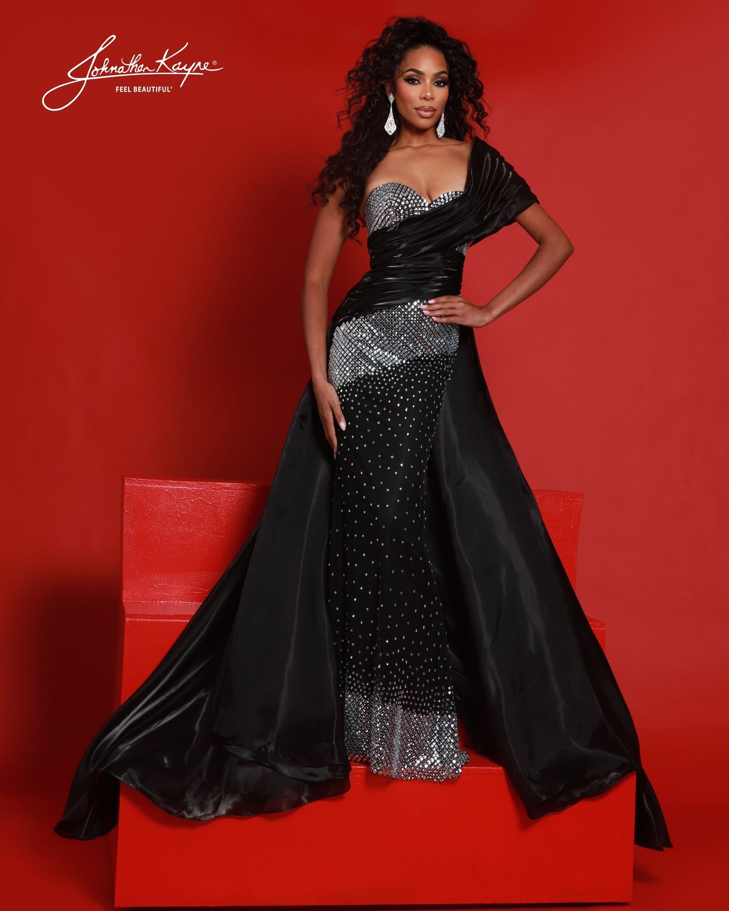 Designer: Johnathan Kayne — Style 3243
Style 3243 is a flowy Johnathan Kayne long prom dress crafted from lightweight special occasion fabrics for beautiful movement. The skirt glides effortlessly with every step, creating an elegant pageant dress silhouette that photographs beautifully and stands out on stage or on the dance floor.

Sizes: 000, 00, 0, 2, 4, 6, 8, 10, 12, 14, 16
Colors: Black, Cherry, Ice Blue, White