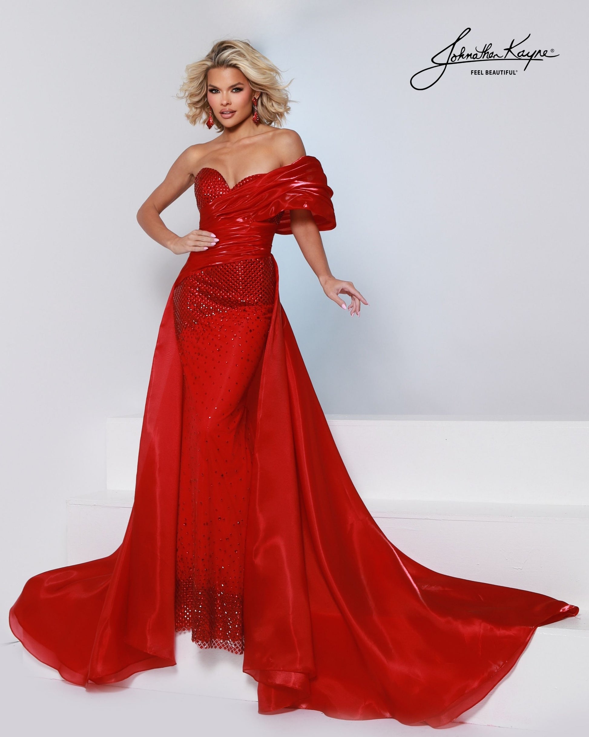 Designer: Johnathan Kayne — Style 3243
Style 3243 is a flowy Johnathan Kayne long prom dress crafted from lightweight special occasion fabrics for beautiful movement. The skirt glides effortlessly with every step, creating an elegant pageant dress silhouette that photographs beautifully and stands out on stage or on the dance floor.

Sizes: 000, 00, 0, 2, 4, 6, 8, 10, 12, 14, 16
Colors: Black, Cherry, Ice Blue, White