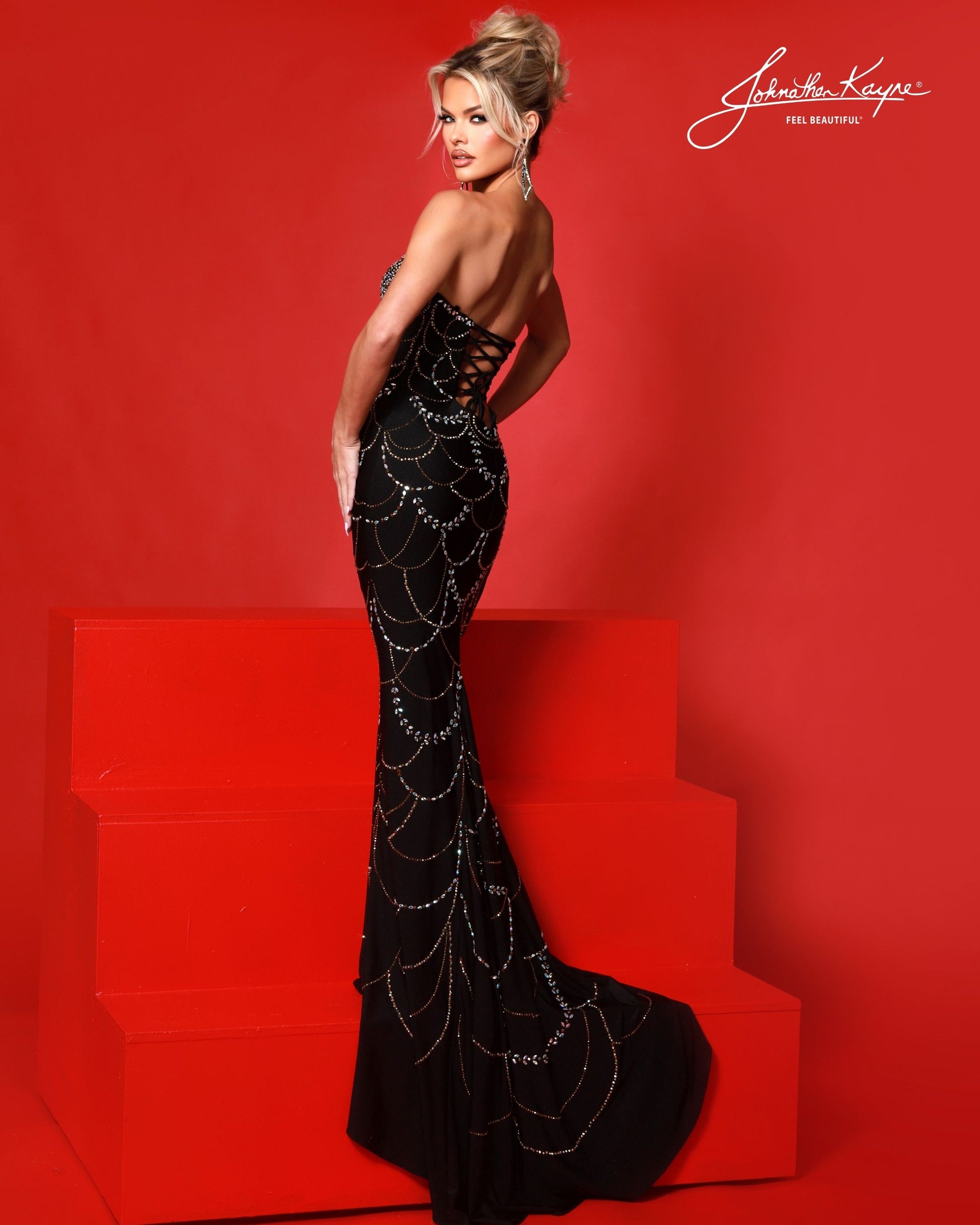 Designer: Johnathan Kayne — Style 3245
Designed in stretch knit fabrics, Johnathan Kayne style 3245 is a body-conscious long prom dress that offers both comfort and style. The stretchy construction allows the dress to move with you, making it a great option for pageant, prom, or any event where a fitted gown with flexibility is desired.

Sizes: 000, 00, 0, 2, 4, 6, 8, 10, 12, 14, 16
Colors: Black, Light Nude, Red
