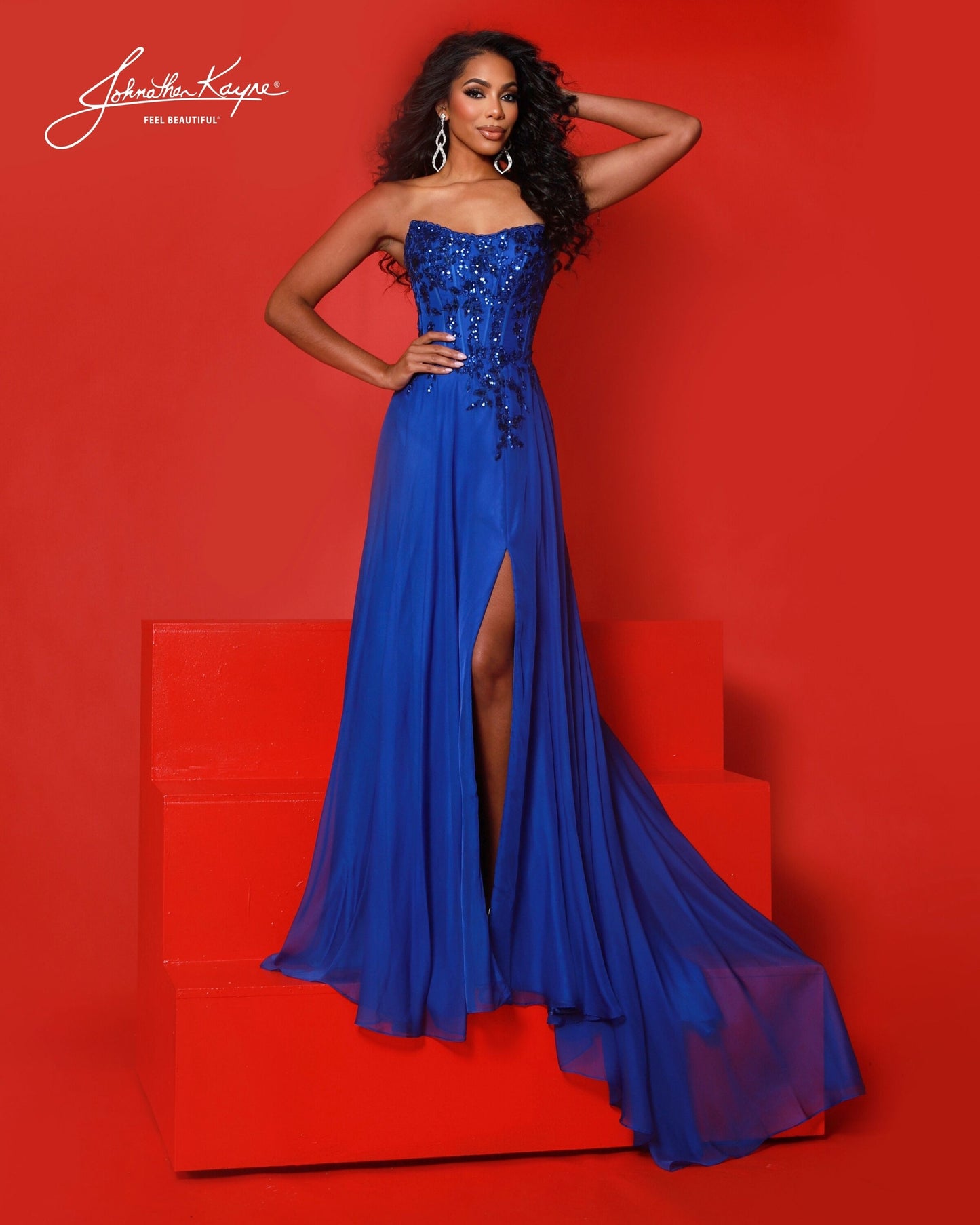 Designer: Johnathan Kayne — Style 3256
Style 3256 is a flowy Johnathan Kayne long prom dress crafted from lightweight special occasion fabrics for beautiful movement. The skirt glides effortlessly with every step, creating an elegant pageant dress silhouette that photographs beautifully and stands out on stage or on the dance floor.

Sizes: 000, 00, 0, 2, 4, 6, 8, 10, 12, 14, 16
Colors: Black, Emerald, Red, Royal