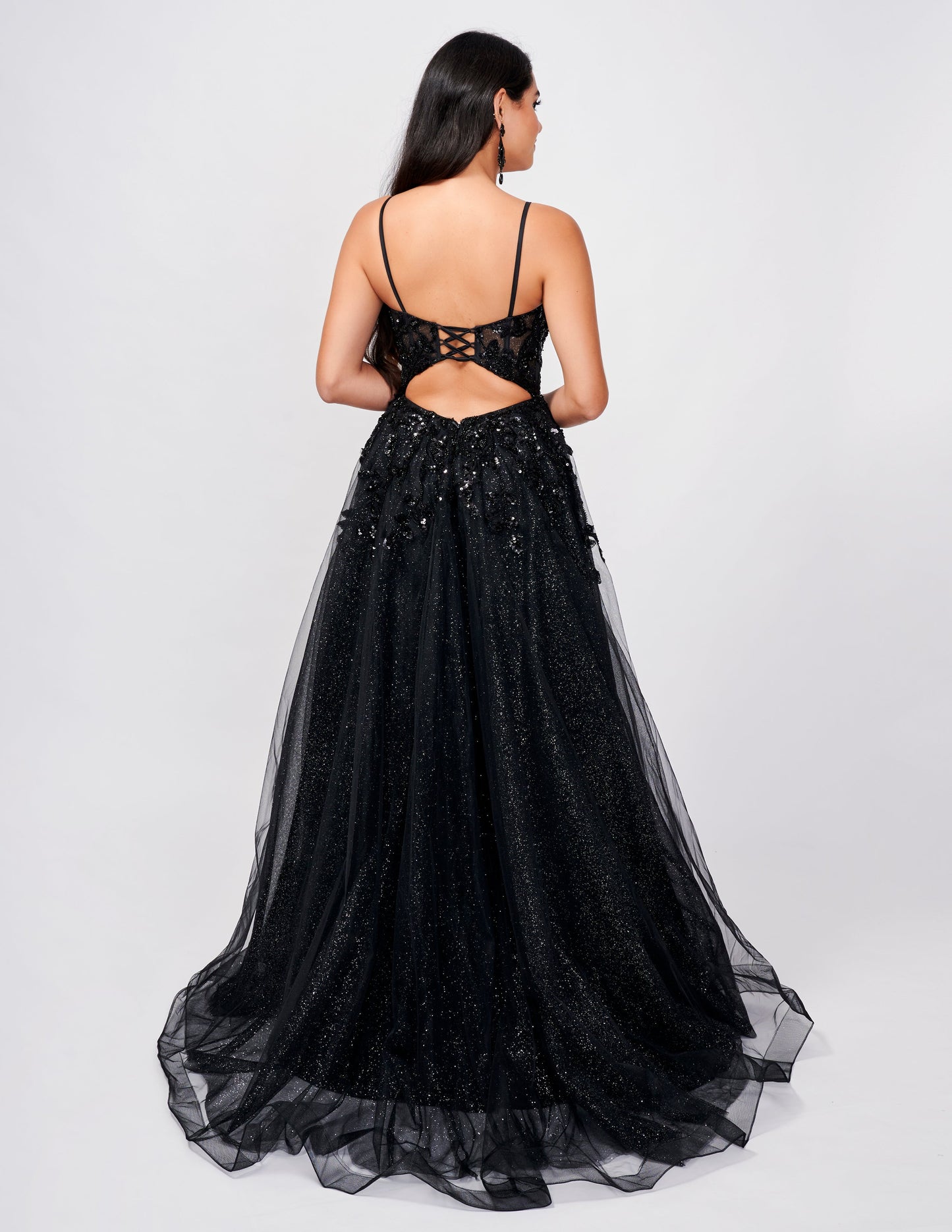 <p data-mce-fragment="1">This stunning Nina Canacci 3262 dress features shimmering tulle, a backless design, and a lace corset with sequins. The A-line maxi silhouette is elevated with a high slit, creating a striking and elegant look. Perfect for prom or any special occasion, this dress is sure to make a statement.</p> <p data-mce-fragment="1">Sizes: 0-14</p> <p data-mce-fragment="1">Colors: Black, Emerald</p>