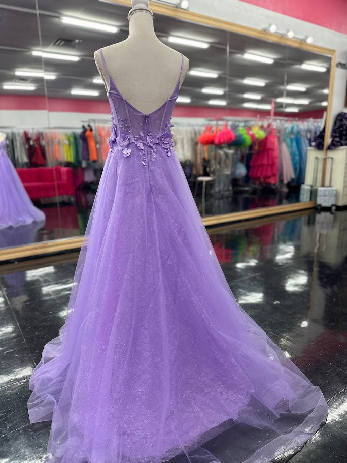 Elevate your evening with this Nina Canacci prom dress, featuring a delicate lilac lace overlay that shimmers subtly under the light. The A-line silhouette flatters with a graceful flow, while the V-neckline adds a refined touch. Intricate 3D floral appliqués adorn the corset bodice, creating a captivating blend of texture and elegance. Perfect for making a memorable statement at any formal event.

Size: 4

Colors: Lilac