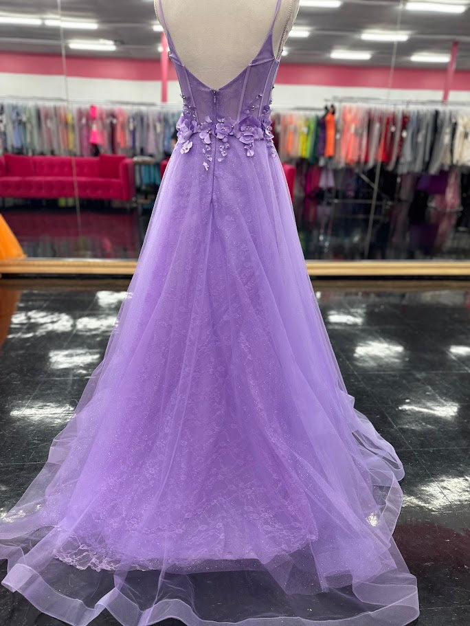 Elevate your evening with this Nina Canacci prom dress, featuring a delicate lilac lace overlay that shimmers subtly under the light. The A-line silhouette flatters with a graceful flow, while the V-neckline adds a refined touch. Intricate 3D floral appliqués adorn the corset bodice, creating a captivating blend of texture and elegance. Perfect for making a memorable statement at any formal event.

Size: 4

Colors: Lilac