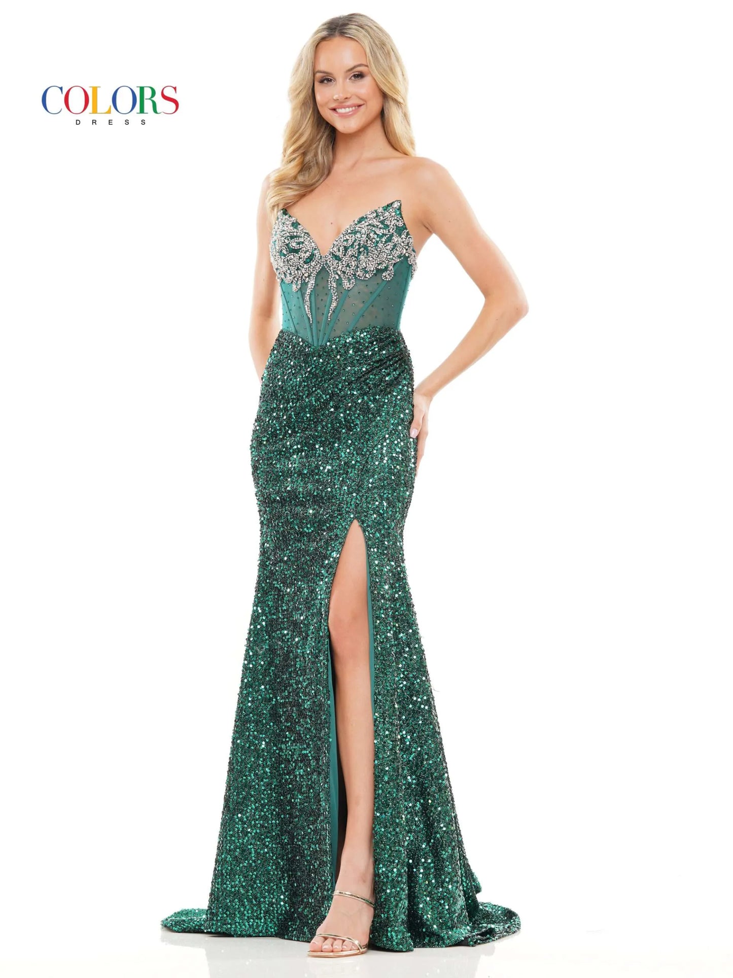 Look stunning in the Colors Dress 3274 Prom Dress. The sheer, beaded corset highlights a peak point v neckline while the sequin fitted silhouette and ruched gown add elegance. With a slit to show off your legs, this dress is perfect for any special occasion.  Sizes: 0-20  Colors: Black, Red, Royal, Deep Green
