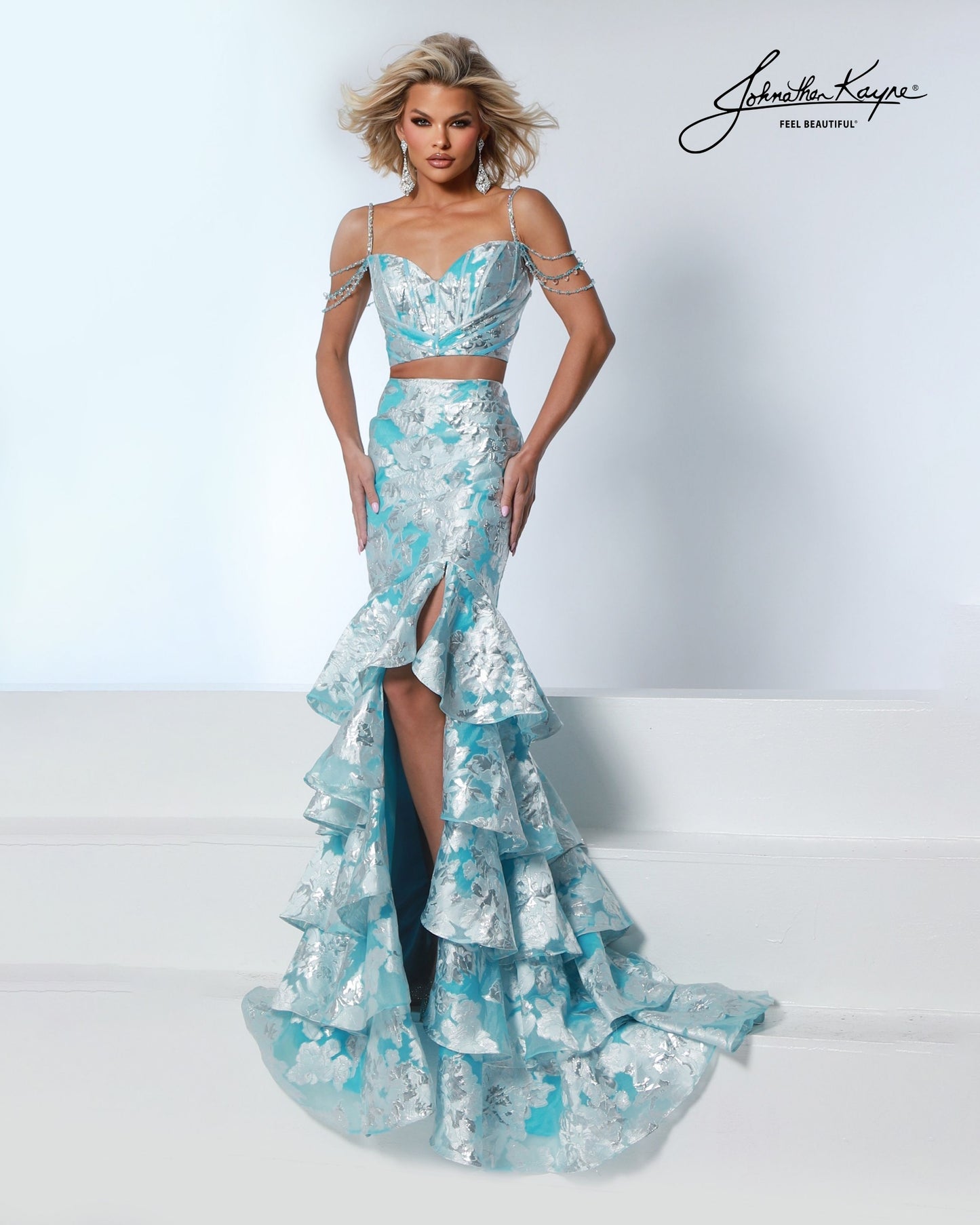 Designer: Johnathan Kayne — Style 3274
Style 3274 is a flowy Johnathan Kayne long prom dress crafted from lightweight special occasion fabrics for beautiful movement. The skirt glides effortlessly with every step, creating an elegant pageant dress silhouette that photographs beautifully and stands out on stage or on the dance floor.

Sizes: 000, 00, 0, 2, 4, 6, 8, 10, 12, 14, 16
Colors: Metallic Blue, Metallic Pink
