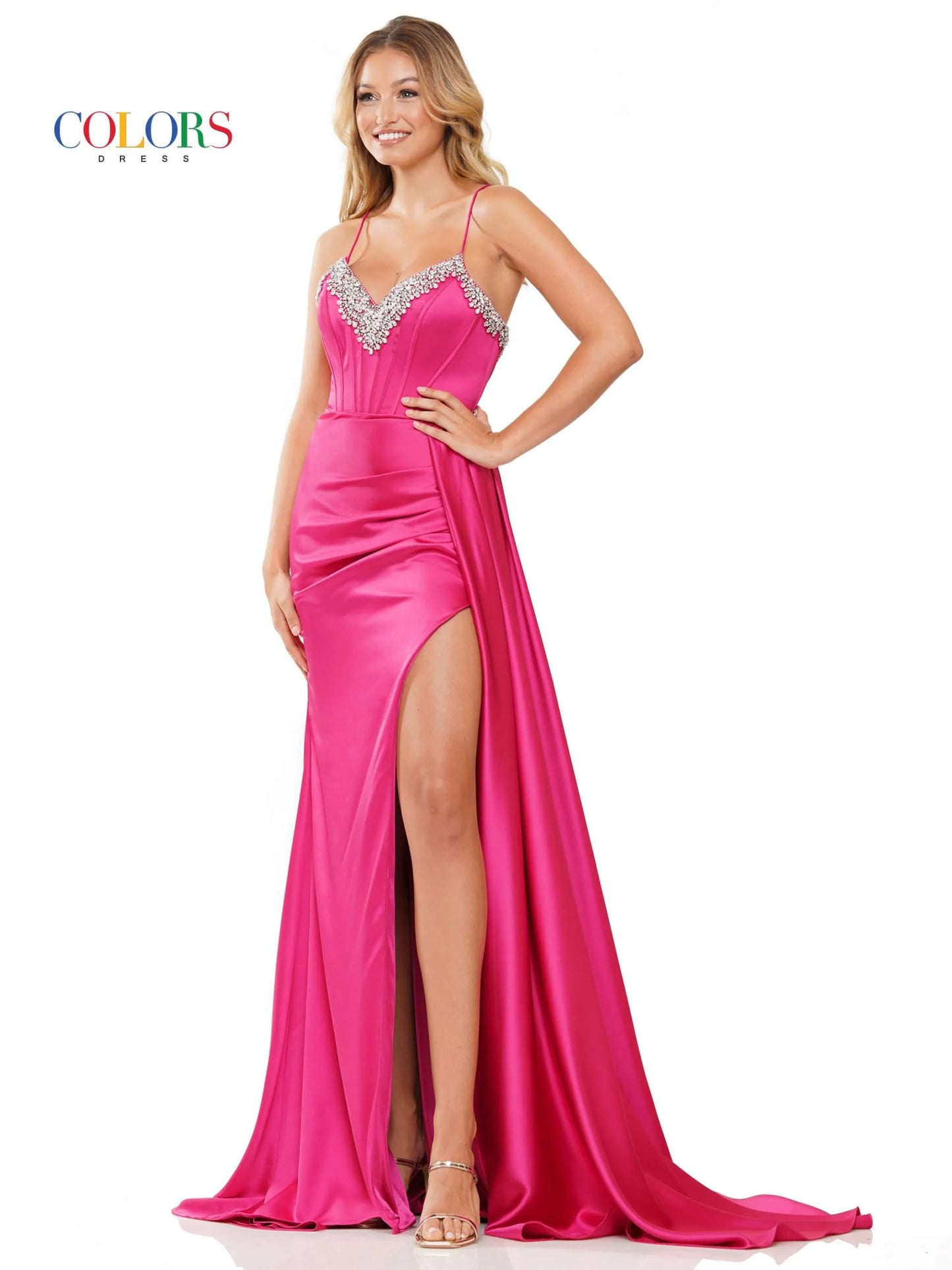 Experience elegance and glamour in this Colors Dress 3305. The stunning beaded corset V neck adds a touch of sparkle, while the satin fabric provides a luxurious feel. The high slit and side overskirt along with the ruched back create a flattering silhouette. Perfect for formal events and pageants, this dress exudes confidence and sophistication. Prom  Sizes: 0-22  Colors: Black, Red, Royal, Hot Pink