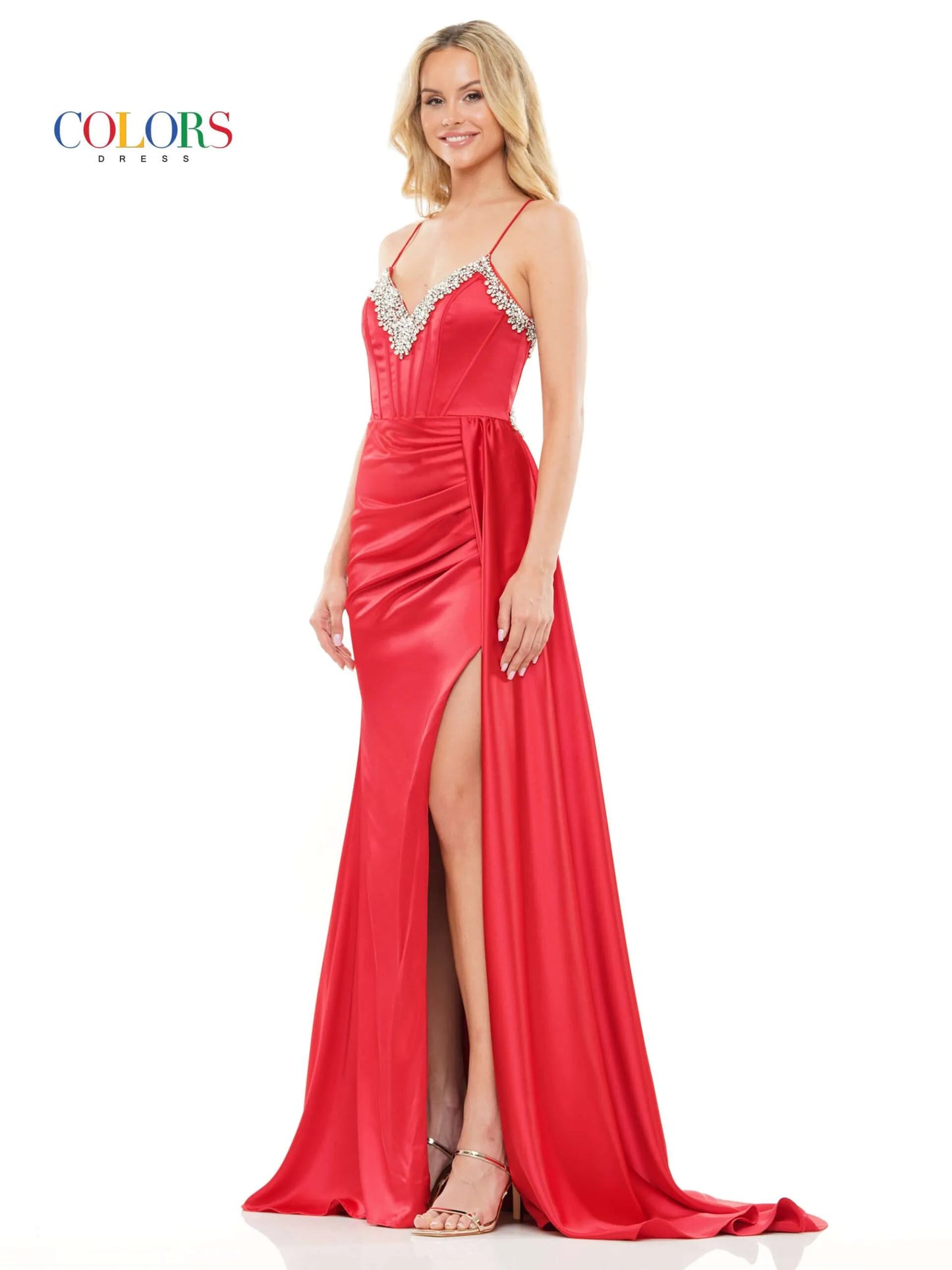 Experience elegance and glamour in this Colors Dress 3305. The stunning beaded corset V neck adds a touch of sparkle, while the satin fabric provides a luxurious feel. The high slit and side overskirt along with the ruched back create a flattering silhouette. Perfect for formal events and pageants, this dress exudes confidence and sophistication. Prom  Sizes: 0-22  Colors: Black, Red, Royal, Hot Pink