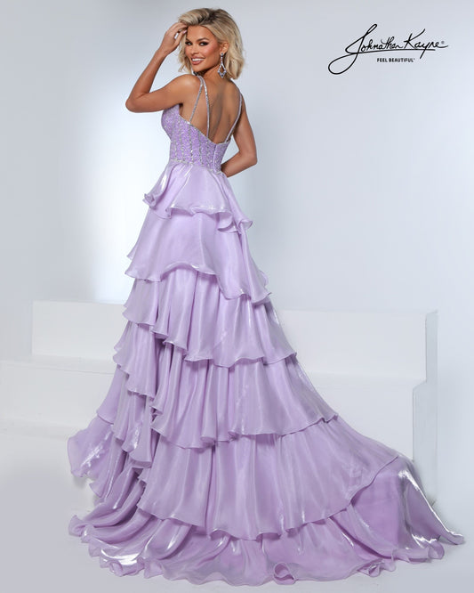 Designer: Johnathan Kayne — Style 3309
Style 3309 is a flowy Johnathan Kayne long prom dress crafted from lightweight special occasion fabrics for beautiful movement. The skirt glides effortlessly with every step, creating an elegant pageant dress silhouette that photographs beautifully and stands out on stage or on the dance floor.

Sizes: 000, 00, 0, 2, 4, 6, 8, 10, 12, 14, 16
Colors: Black, Lilac