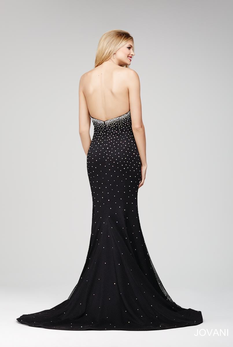 Elevate your evening with this exquisite Jovani 33132 mermaid gown in pristine white. Designed in a size 4, this long prom dress features a strapless sweetheart neckline that beautifully frames the shoulders. Adorned with delicate crystal embellishments, it offers a refined sparkle perfect for pageants or formal occasions. The fitted silhouette gracefully accentuates your figure, ensuring a stunning and sophisticated presence at any event.

Size: 4

Color: White