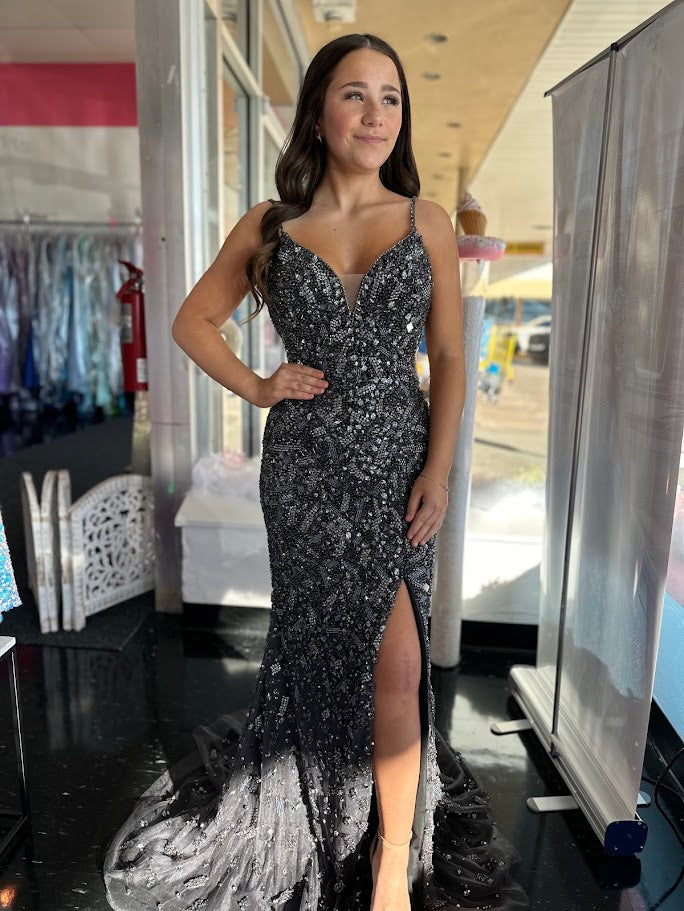 Step into elegance with Colors Dress 3387, a fully beaded formal prom dress that boasts a stunning V-neckline and crystal accents. The slit adds a touch of allure to this evening gown, perfect for standing out at any formal event. With its intricate beading and luxurious details, this dress is sure to make a statement.

Sizes: 2, 10, 14

Colors: Gunmetal