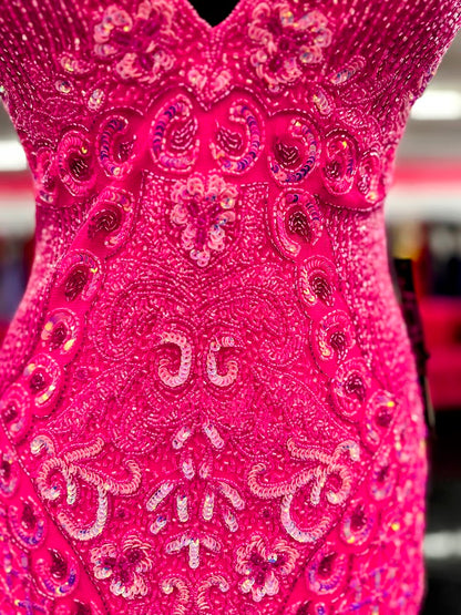 Jovani 36425 Beaded Mesh Fabric Low V-Neck Embellished Short Dress.&nbsp;Dazzle in the limelight with Jovani's 36425 Emerald Low V Neck! This stunning cocktail dress from Jovani's collection features a beaded mesh fabric and fitted style that will flatter your curves. This dress epitomizes elegance and sophistic with intricate beading, spaghetti straps, an open back, and a low V-neckline.