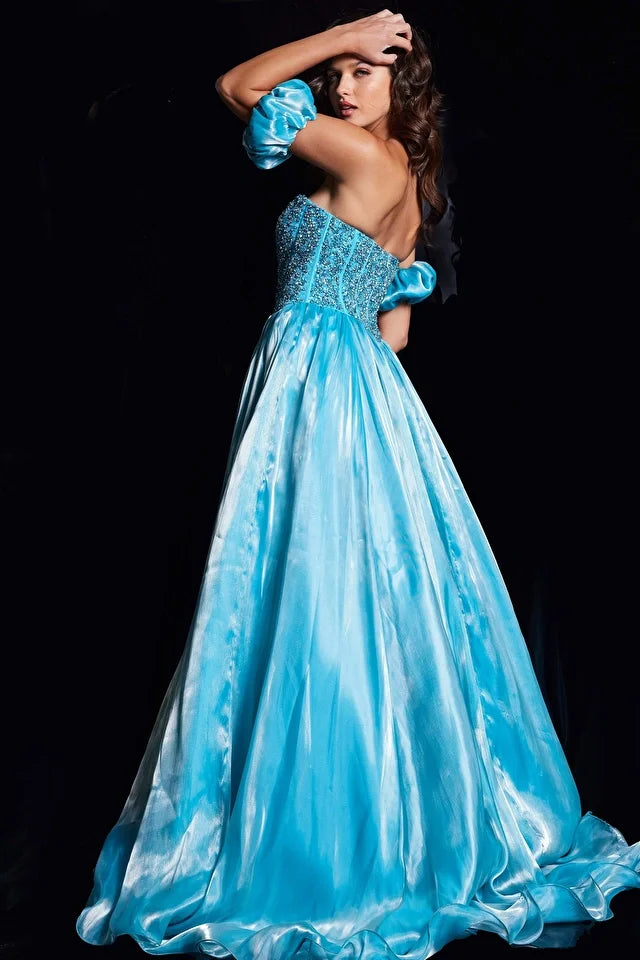 Elevate your prom or pageant look with the Jovani 36591 Long Prom Dress. This stunning gown features a corset fit and flare silhouette with intricate beaded details, and detachable ruffle sleeves for added drama. Perfect for making a statement and standing out in a sea of dresses. Elevate your prom or pageant look with the Jovani 36591 Long Prom Dress - a captivating combination of a corset fit and flare silhouette and exquisite beaded embellishments. 