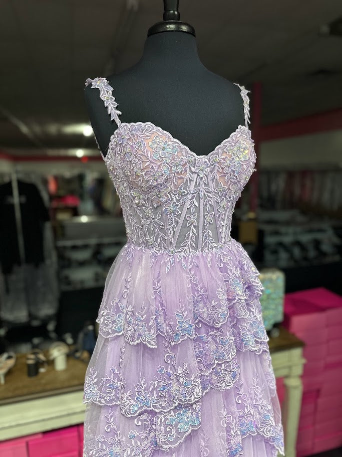 The Jovani 36687 is a breathtaking prom dress that belongs to the formal collection, designed to make a lasting impression at any special occasion. This enchanting gown is made from delicate tulle, a fabric known for its ethereal and lightweight quality.
