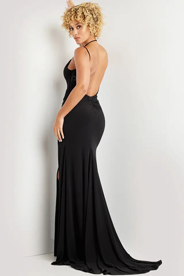 The Jovani 37086 is an alluring formal gown designed to make a bold statement at your special event. Crafted from jersey, this gown features a fitted silhouette that enhances your figure beautifully. The high slit and train add a touch of drama and allure to your overall look.  With its fitted style, the dress exudes a sleek and elegant appearance, ideal for making a memorable entrance. The spaghetti straps over the shoulders and around the neck create a contemporary and alluring design.