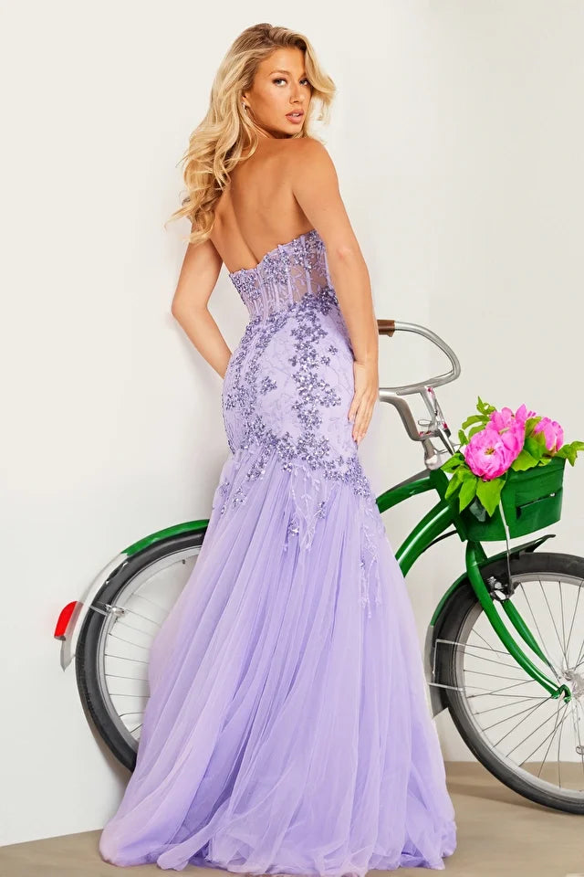 The Jovani 37249 is a dazzling formal gown that exudes glamour and sophistication. Part of the formal collection, this mermaid-style dress is crafted from delicate tulle material, adding an ethereal and romantic quality to the overall design.  The gown is adorned with sequin embellishments and intricate embroidery, creating a stunning play of light and texture. The flare bottom adds a touch of drama, ensuring a captivating and memorable entrance. 