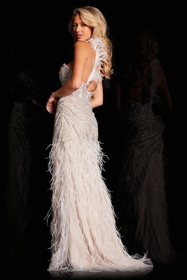 Experience a night of glamour and elegance in the Jovani 37442 Long Prom Dress. With a one shoulder design and a corset back, this dress exudes sophistication. Adorned with delicate beading and feather details, and a high slit for a touch of drama, this dress is perfect for formal events and pageants. 