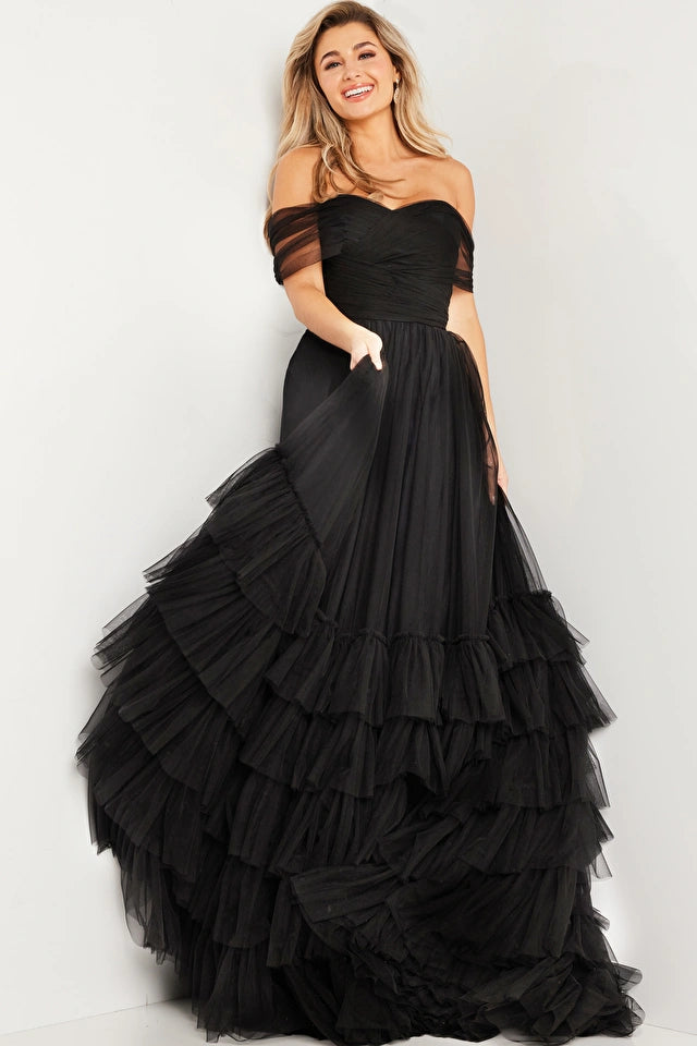 The Jovani 37608 is a breathtaking formal ballgown designed to make you the center of attention at any special event. Made from lightweight and ethereal mesh, this gown offers a comfortable and elegant wear. The ballgown style features an A-line layered skirt that adds a sense of grandeur and a high waist that flatters your silhouette. The pleated bodice complements the flowing skirt beautifully.