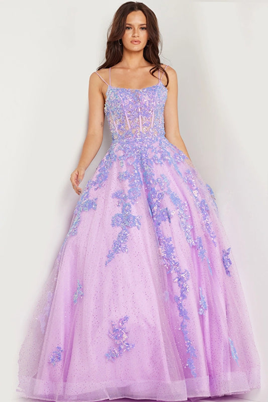 The Jovani 37700 is a dreamy and enchanting formal ballgown, perfect for making a statement at special occasions. Crafted from delicate tulle, this gown is adorned with glitter and sequin embellishments, creating a dazzling and magical effect.  The gown features a sheer corset bodice with boning, adding structure and support while maintaining an ethereal and romantic look. 