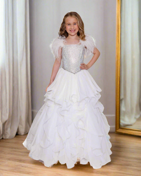 Experience elegance and beauty with the Ava Presley 38039 Feather Crystal Girls Pageant Dress. The lush feather shoulder straps and crystal embellished bodice exude sophistication, while the A-line skirt and ruffle details add a touch of playfulness. Perfect for any special occasion, this dress will make your little girl feel like a princess.