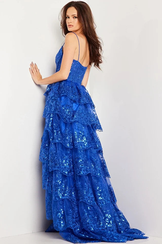 The Jovani 38144 prom dress is a true showstopper and a perfect choice for those looking to make a statement at a formal event. This gown belongs to the formal collection and is designed to capture attention and create a memorable look. The dress is crafted from delicate and ethereal tulle material, which gives it a light and airy quality while maintaining a sense of sophistication.