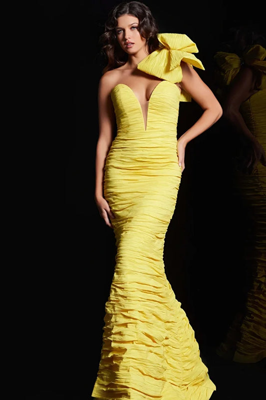 The Jovani 38240 is a stunning formal gown designed to make a bold and glamorous statement at special occasions. It is made from crinkle crushed taffeta, a fabric known for its unique texture and ability to create a dynamic and eye-catching look. The mermaid silhouette of the dress is known for its dramatic, figure-hugging design that flares out at the bottom, adding an element of allure and sophistication to the overall appearance.